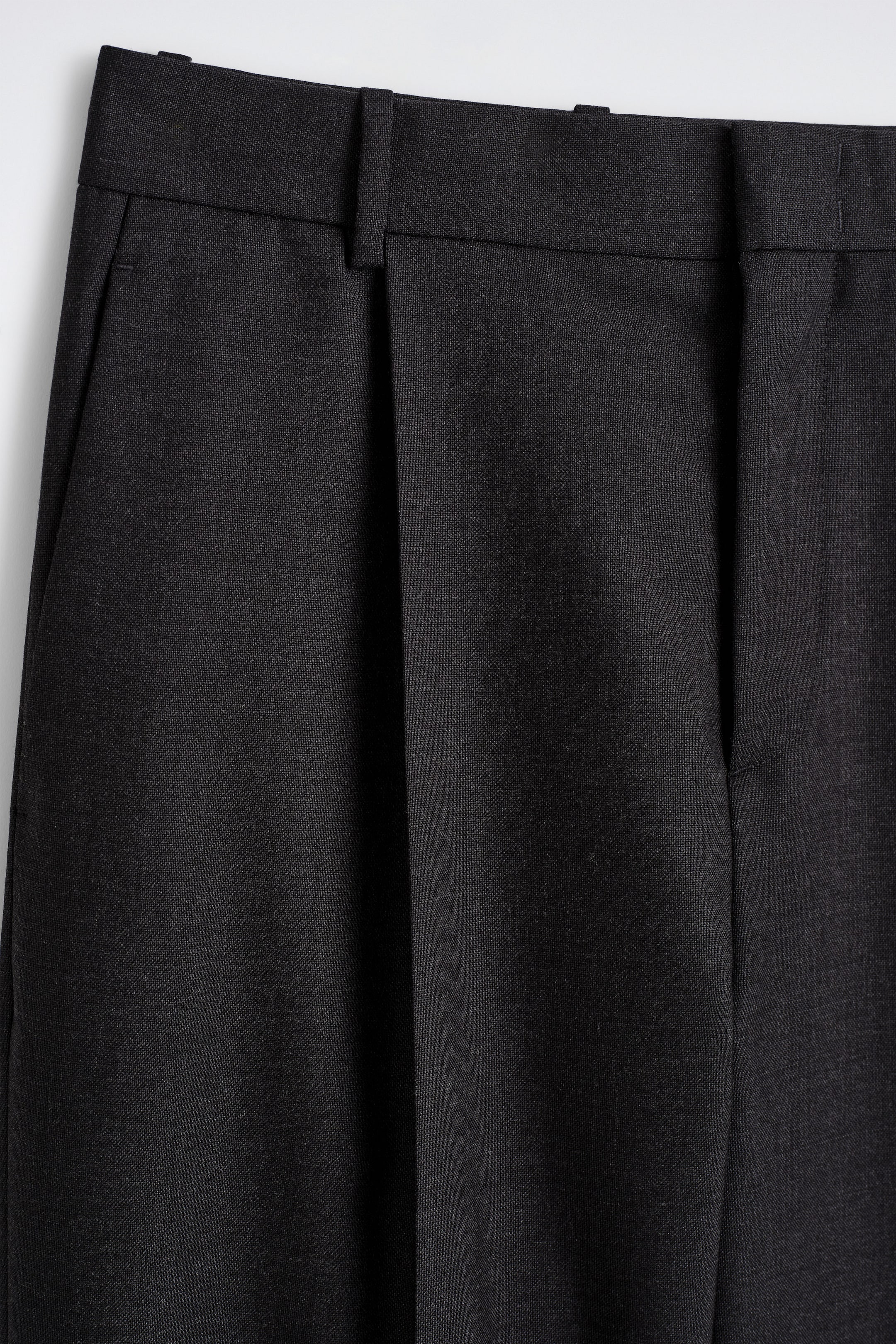 PLEATED WOOL TROUSERS