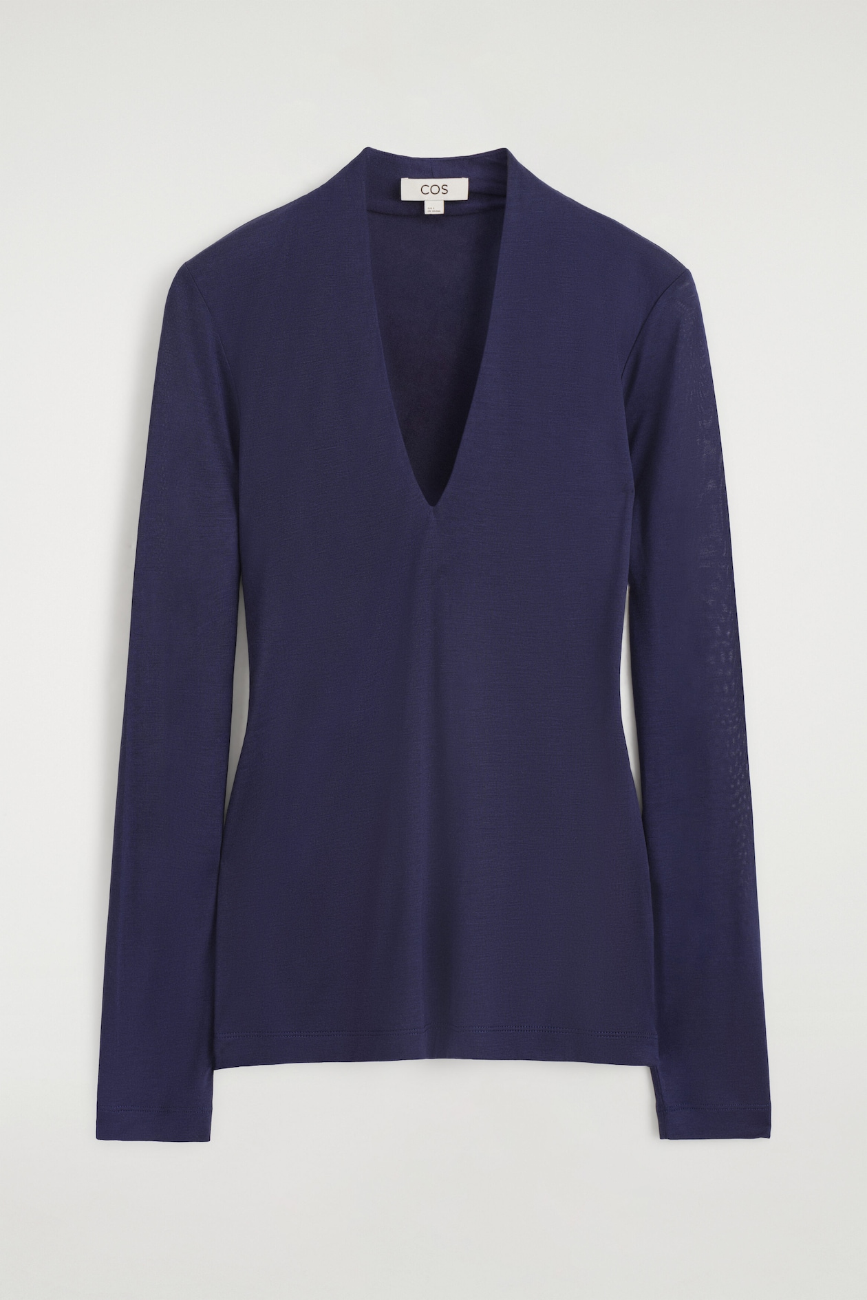 A navy blue long-sleeve top is shown from the front, featuring a slim-fit silhouette and a deep V-neckline. The top is designed with a slightly raised, draped collar at the back of the neck and a clean-finished hem.