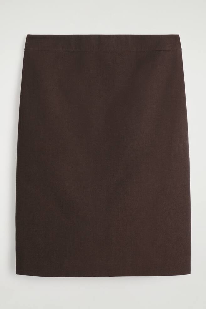 A brown straight skirt is lying flat, seen from the front. It is featuring a smooth, dark brown fabric and a wide, flat waistband. - 1