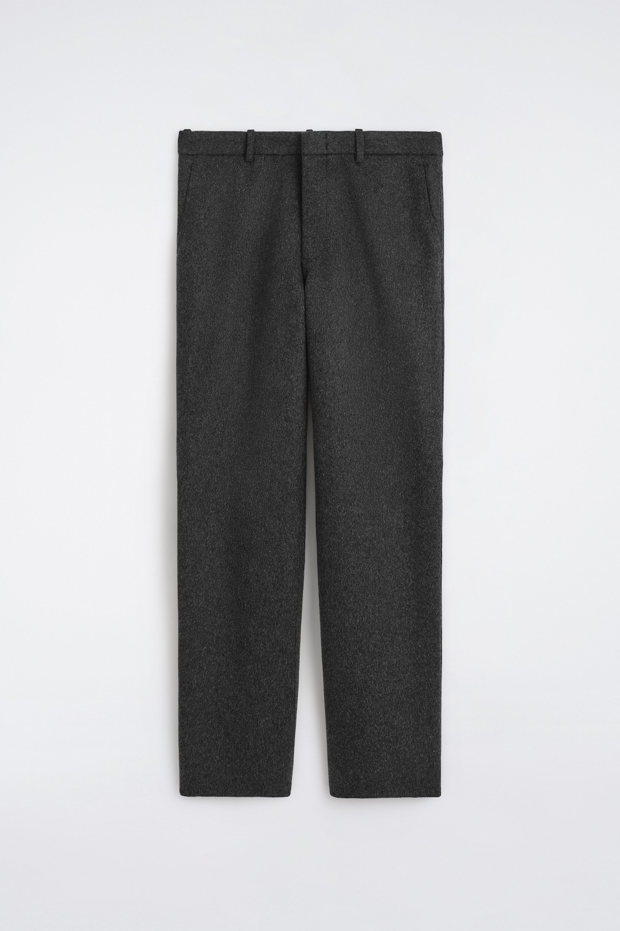 These dark grey wool-blend trousers are shown from the front, featuring a straight-leg silhouette with a soft, textured finish. They include a structured waistband with belt loops and subtle side pockets.