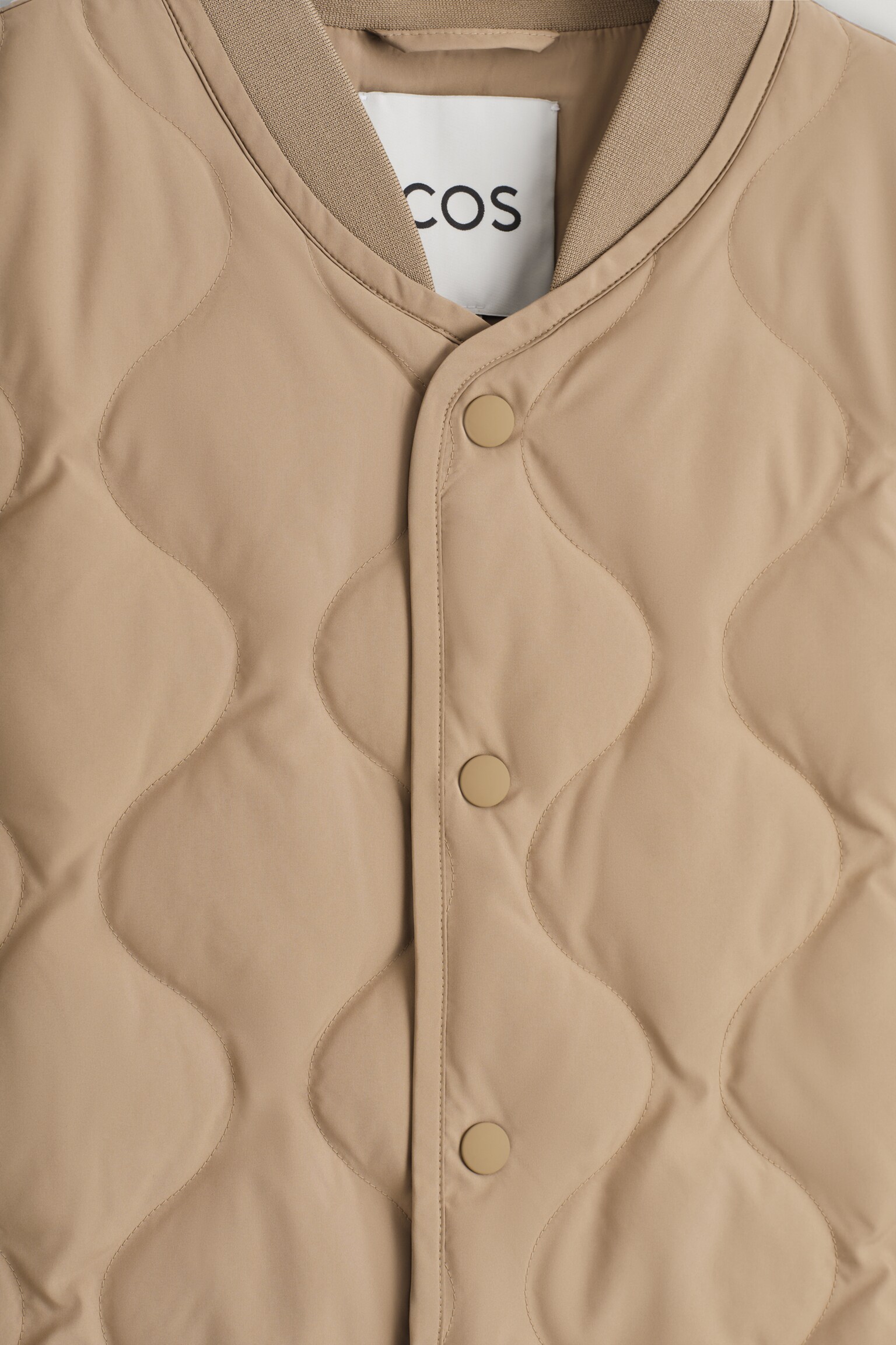 GESTEPPTE DAUNENWESTE - DUNKLES BEIGE/SCHWARZ - 7