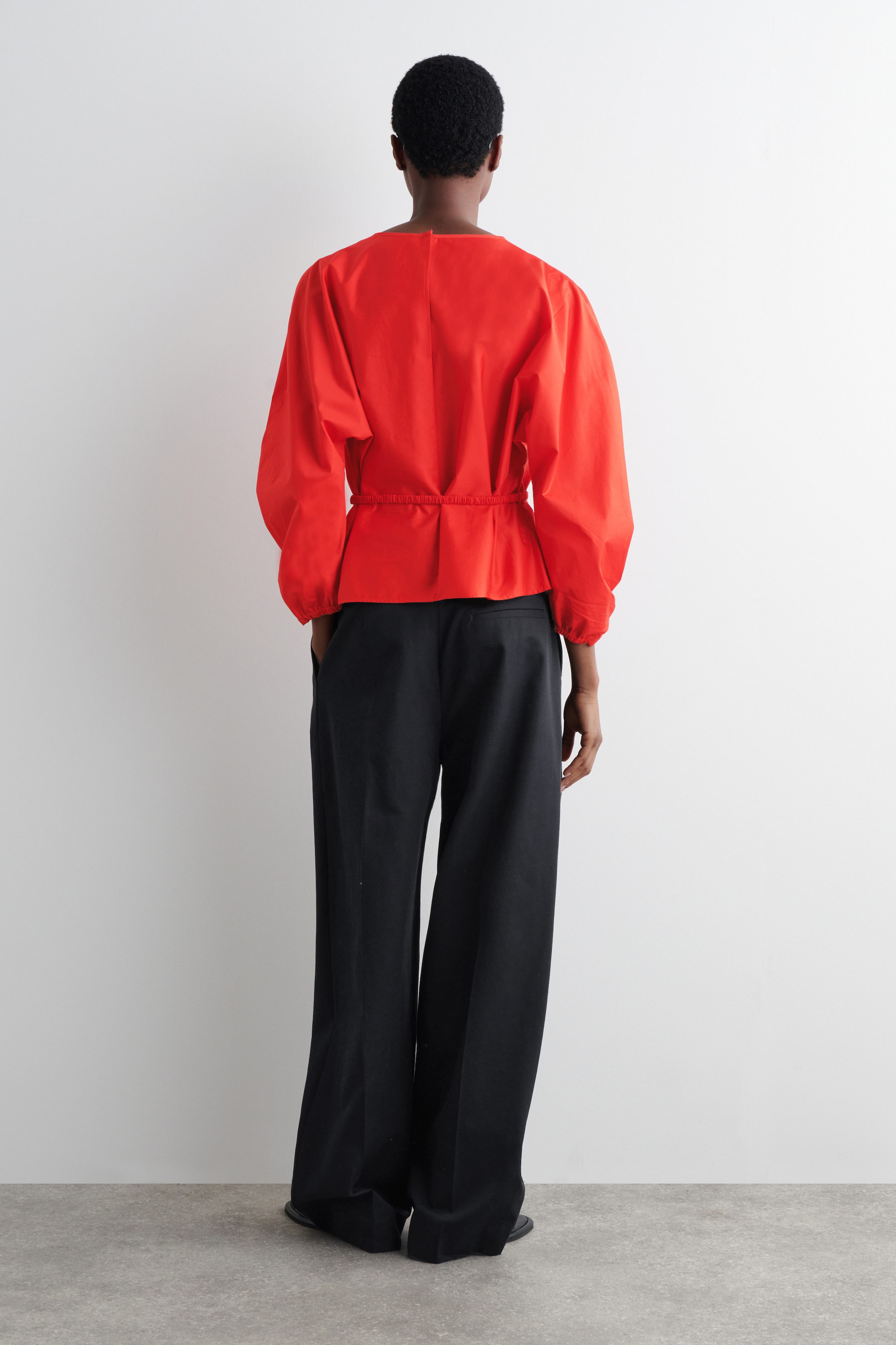 BLOUSE PÉPLUM À CORDON DE SERRAGE