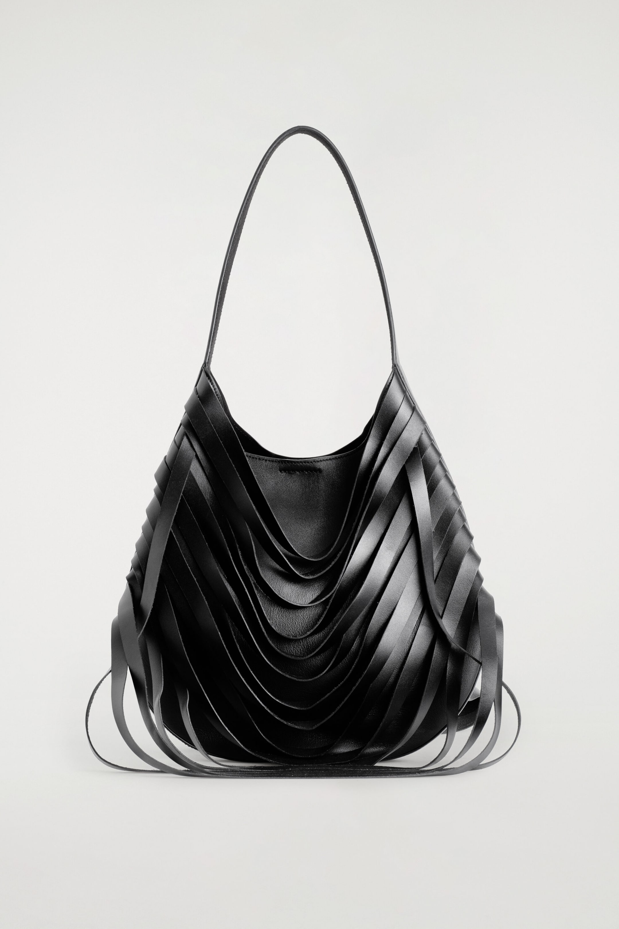 CURVED RAW-CUT SHOULDER BAG - LEATHER