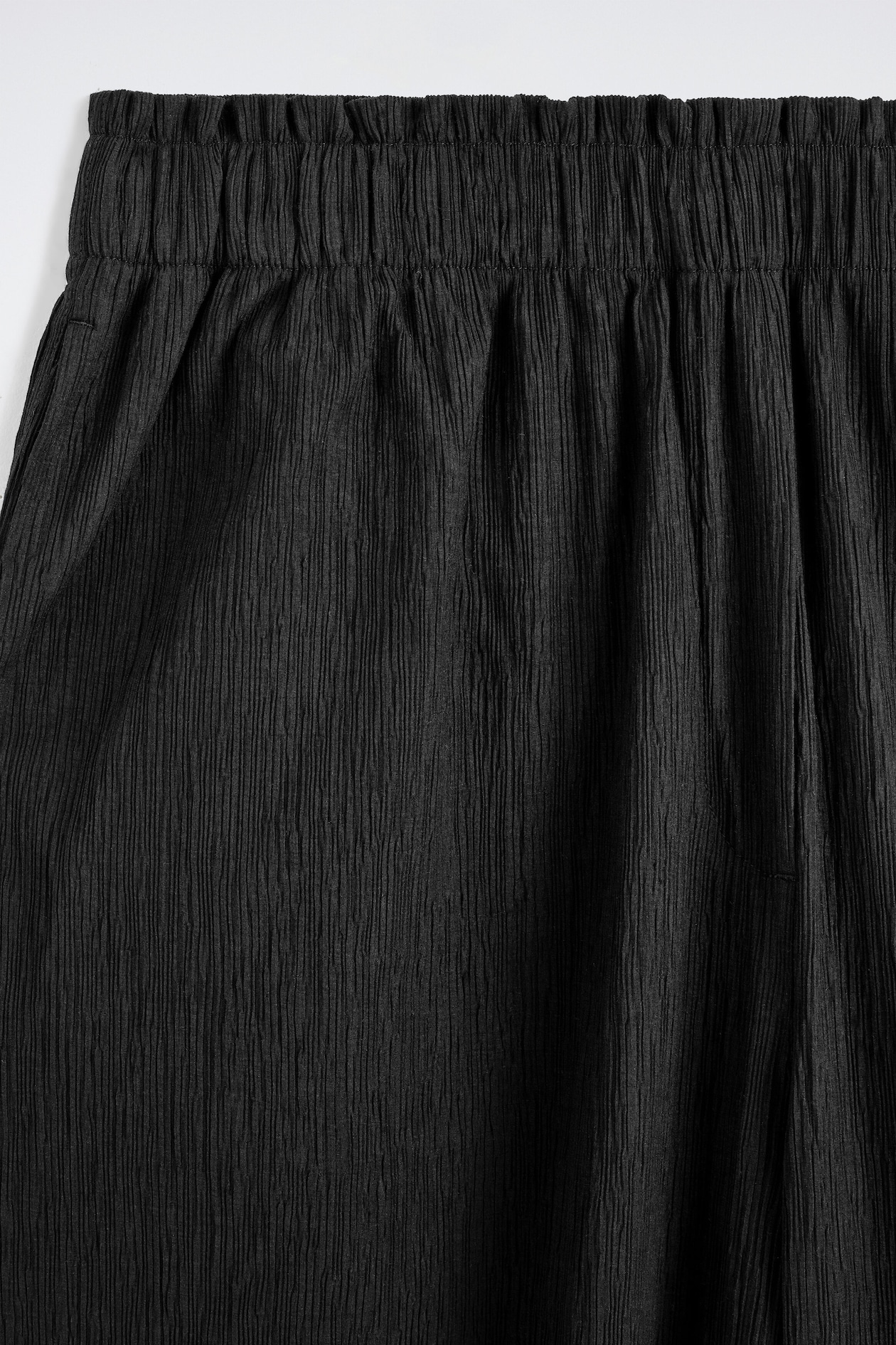 CRINKLED-JERSEY WIDE-LEG TROUSERS — BLACK