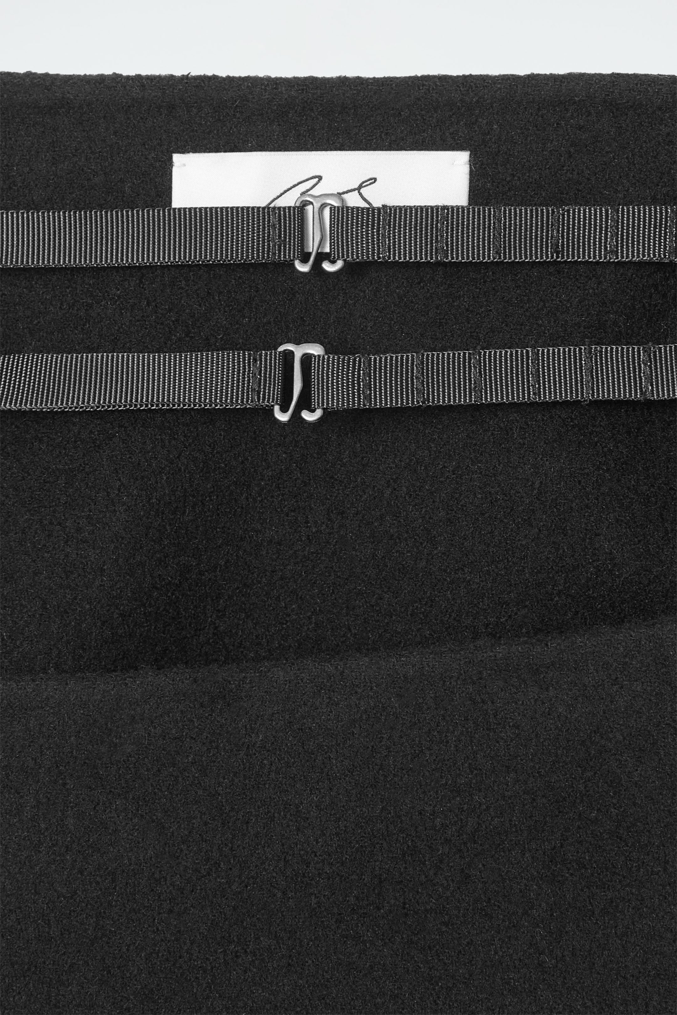 THE DOUBLE-FACED ASYMMETRIC SKIRT