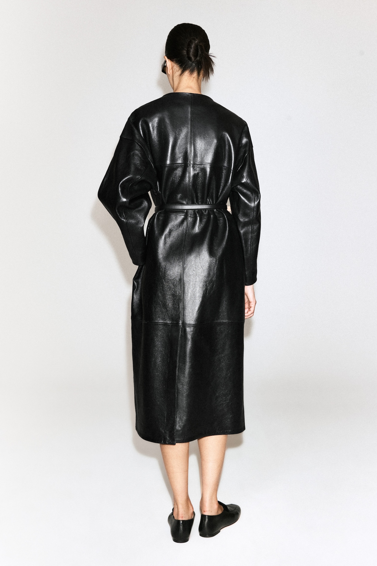 PANELED LEATHER LONG COAT — BLACK