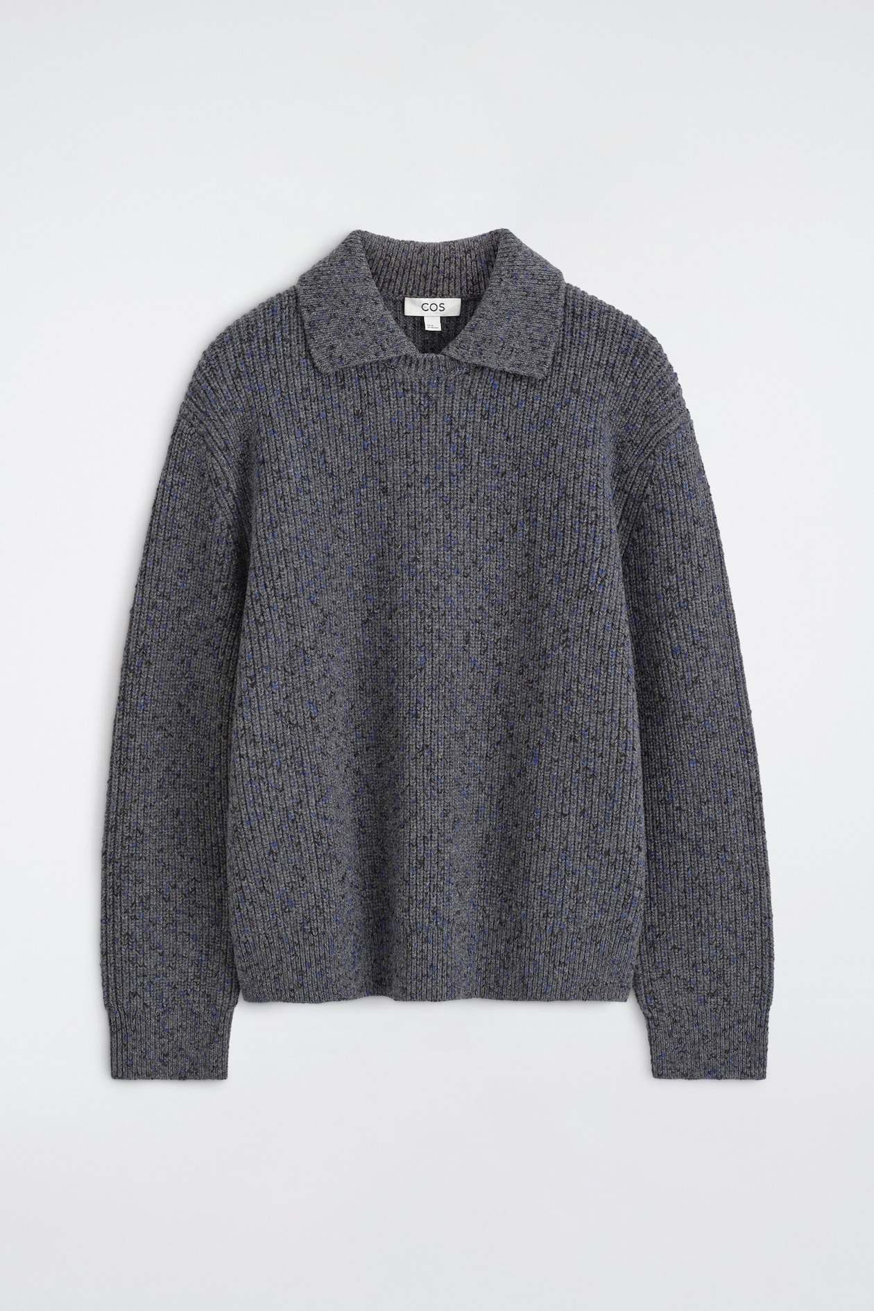 A grey marled rib-knit polo sweater is shown from the front, featuring a spread collar, long sleeves with ribbed cuffs, and a straight hem. The fabric features a textured vertical rib-knit pattern with subtle blue and black flecks woven throughout.