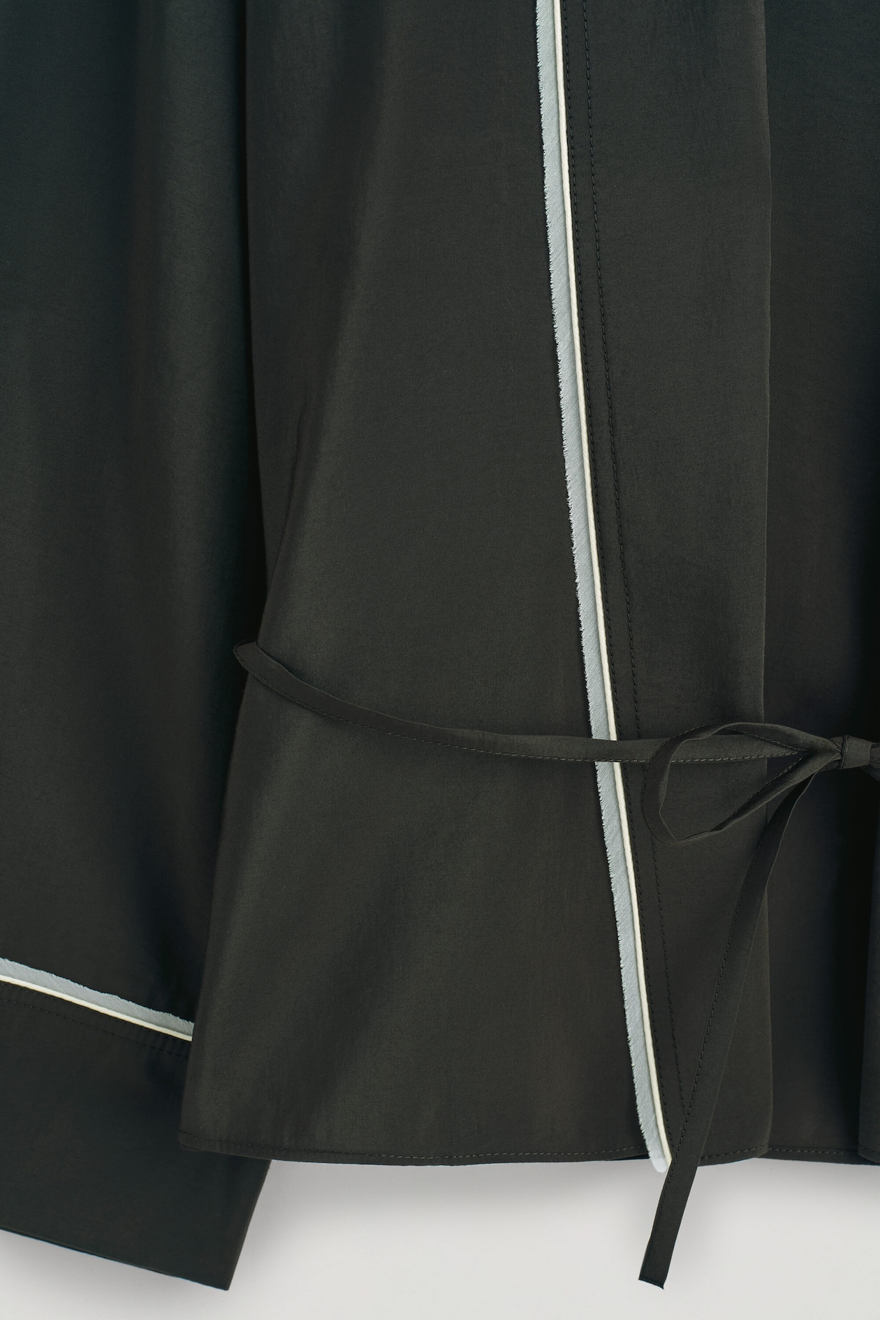 CONTRAST-PIPED BELTED WRAP TOP — DARK GREEN