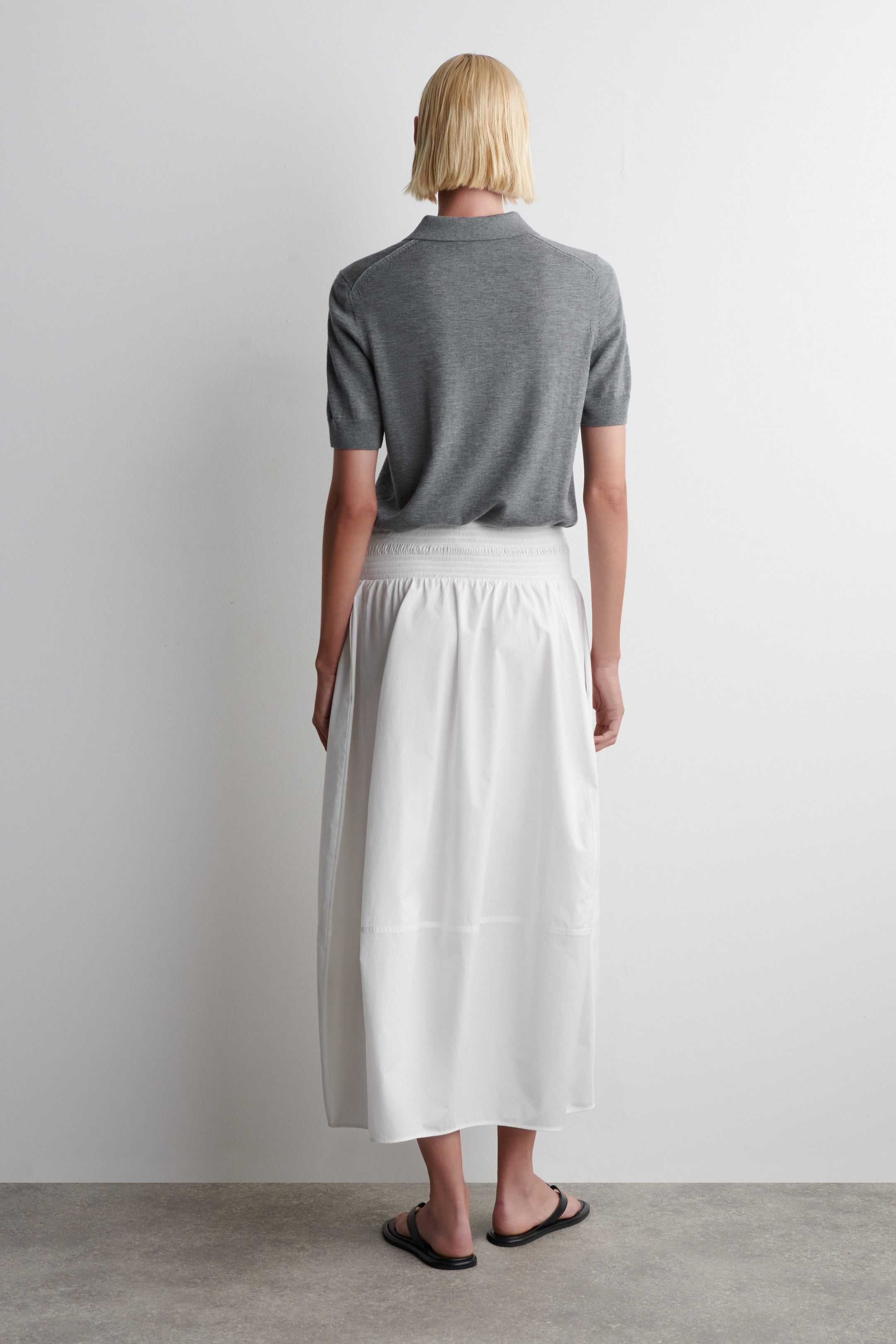 SMOCKED PANELED MIDI SKIRT