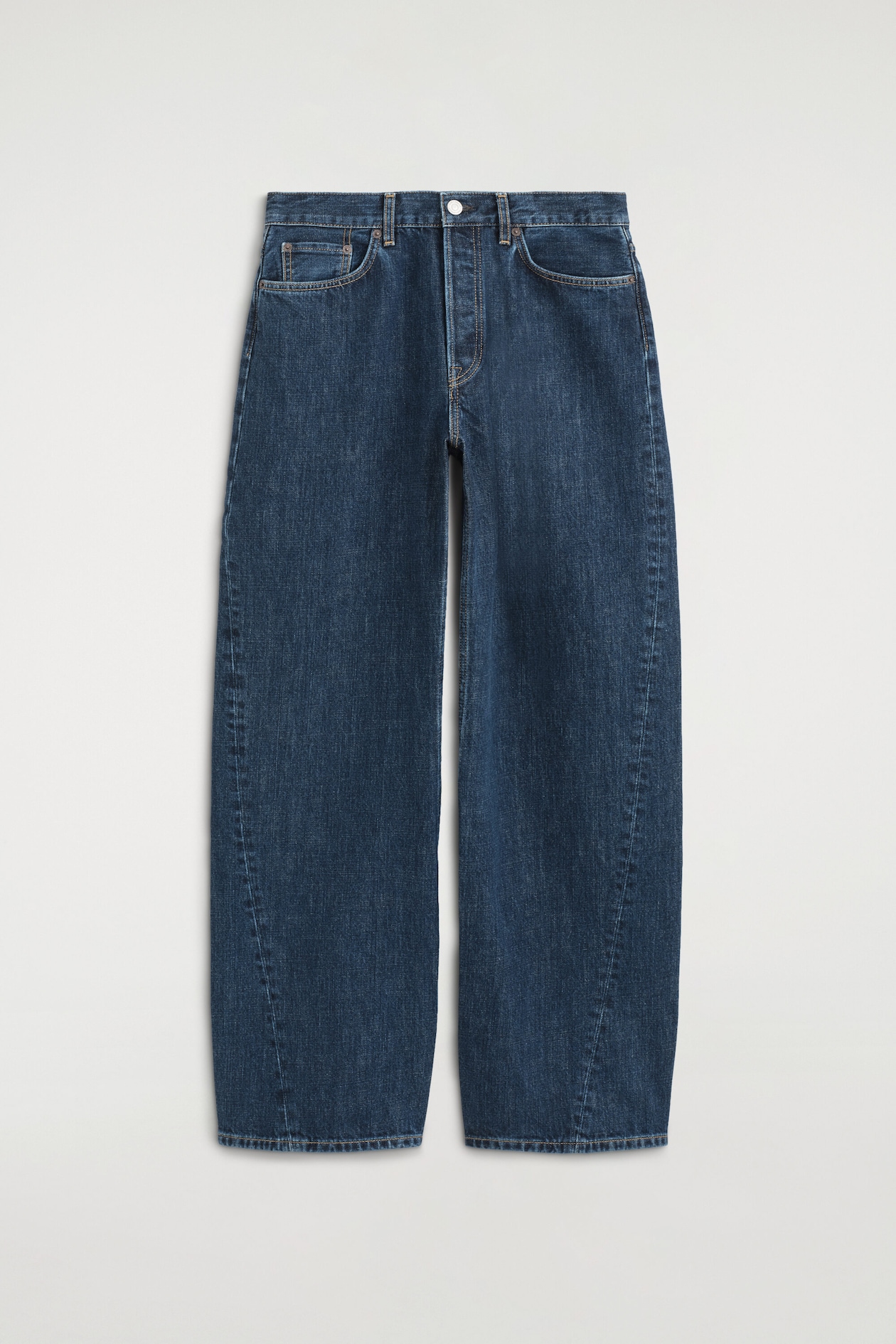 Dark blue wide-leg jeans are shown from the front, featuring a button-fly closure and front scoop pockets with a coin pocket. Light brown contrast stitching details the seams, including a prominent outer leg seam that shapes the wide leg.