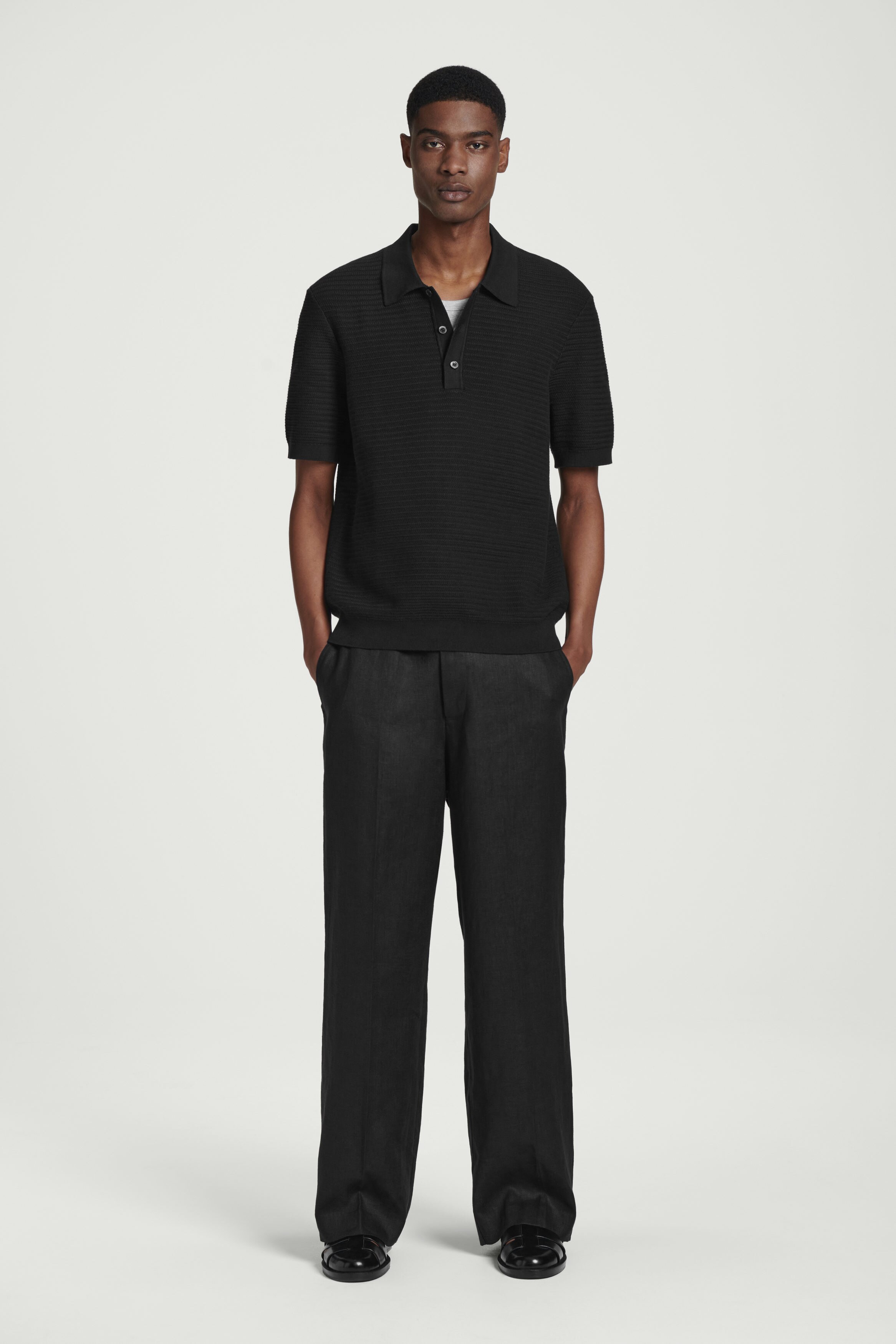 TEXTURED KNITTED COTTON POLO SHIRT - BLACK | COS US