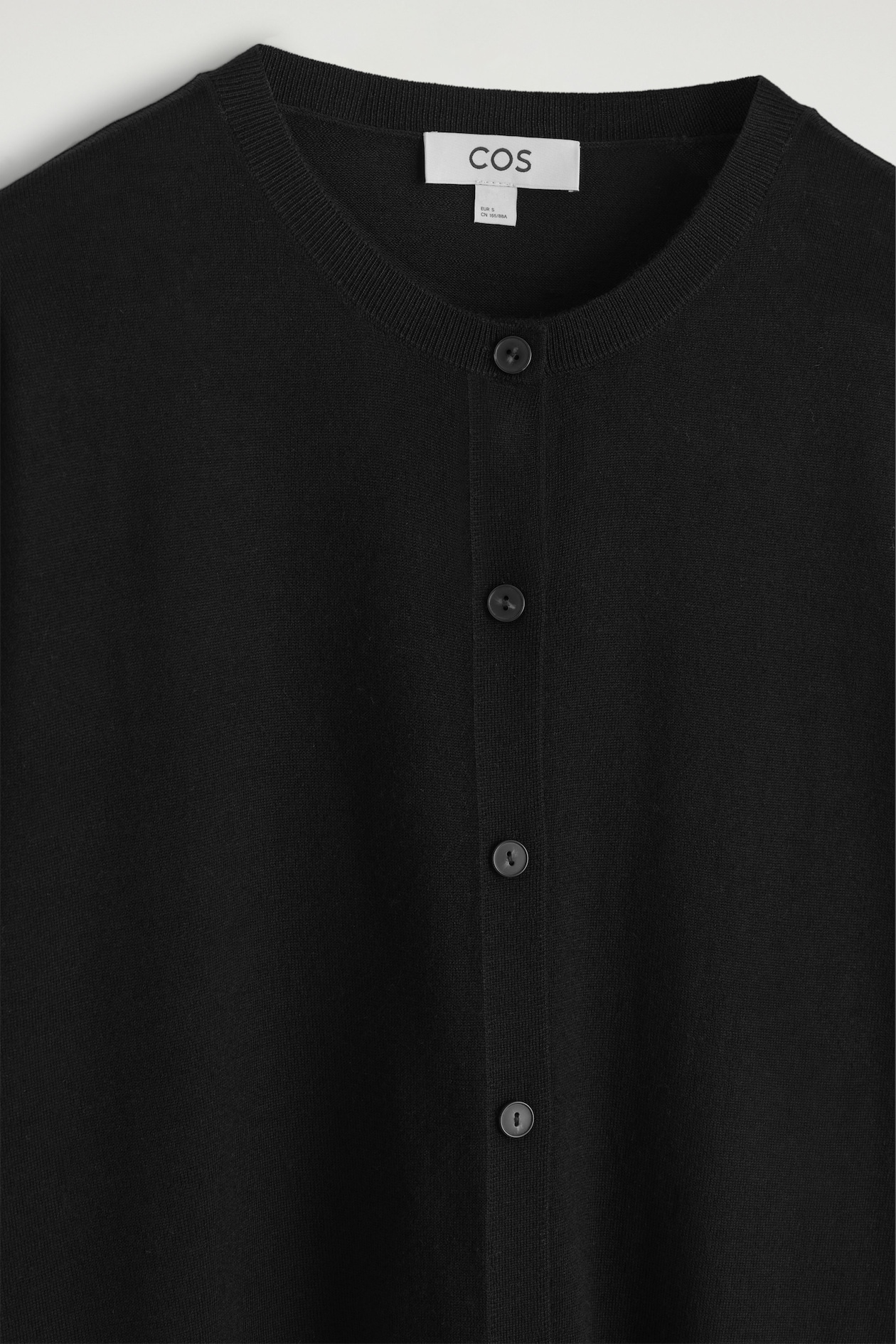 CIRCLE-CUT MERINO WOOL CARDIGAN — BLACK