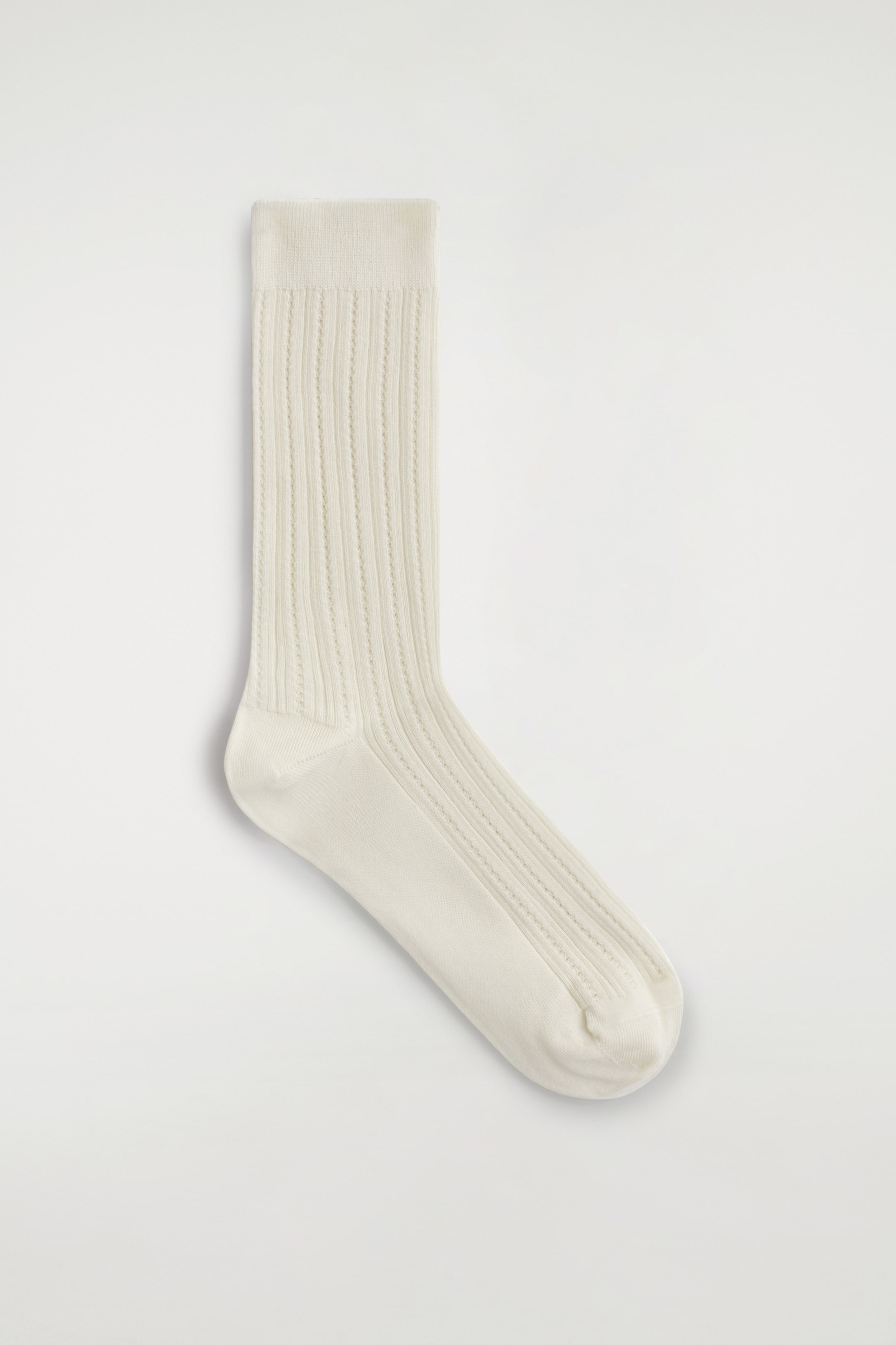 Visa större bild: POINTELLESTICKADE STRUMPOR - GRÄDDVIT - DAM | H&M SE 1