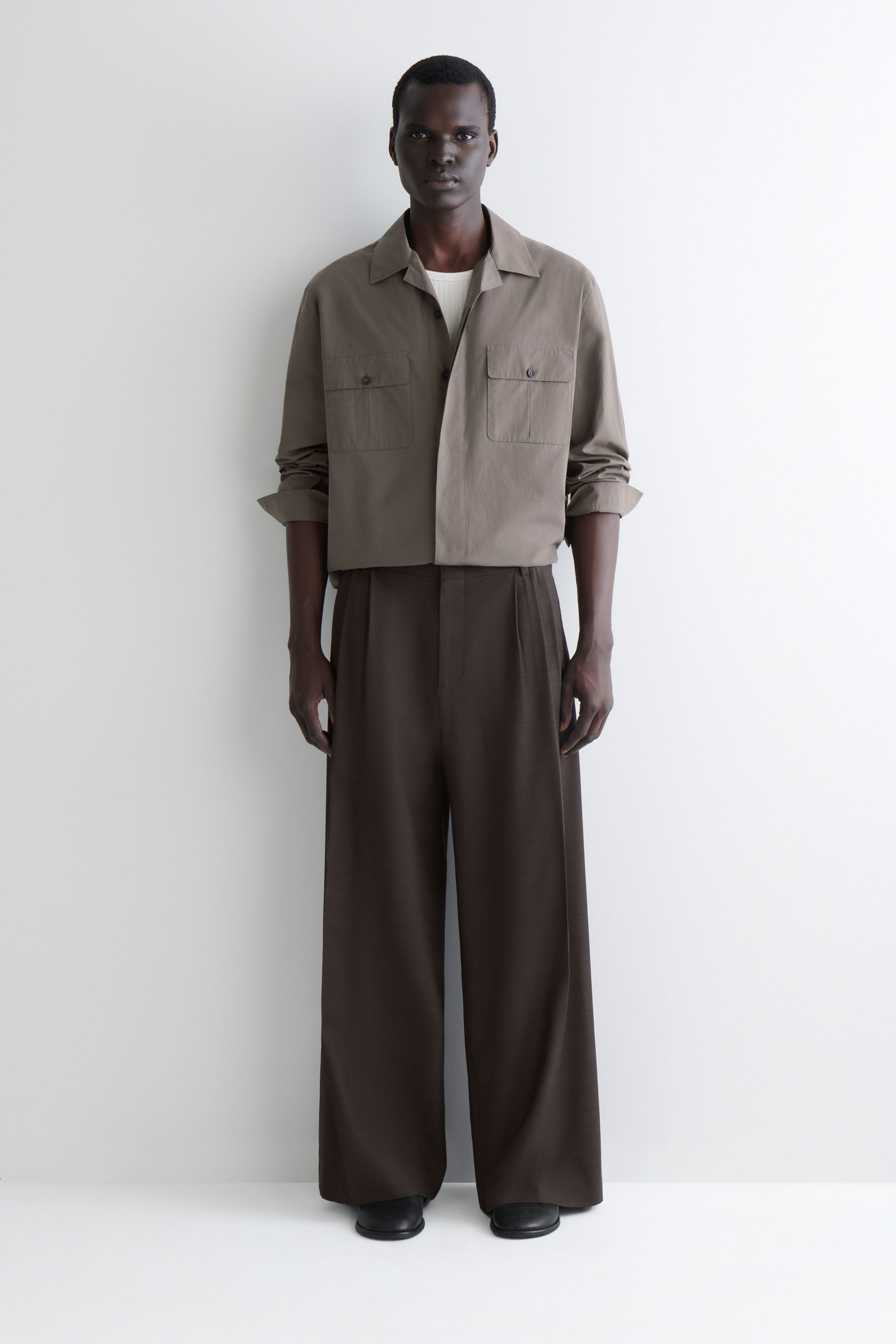 PLEATED WOOL WIDE-LEG TROUSERS