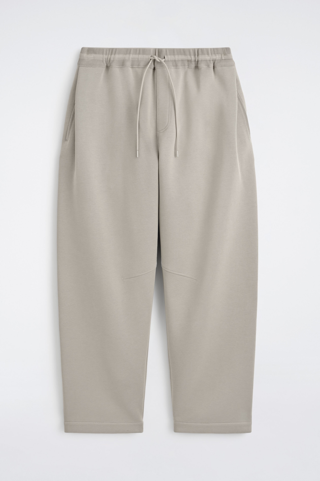 COTTON-PIQUÉ OVERSIZED BARREL-LEG JOGGERS — BEIGE