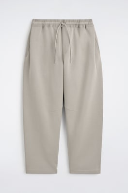 COTTON-PIQUÉ OVERSIZED BARREL-LEG JOGGERS — BEIGE 7