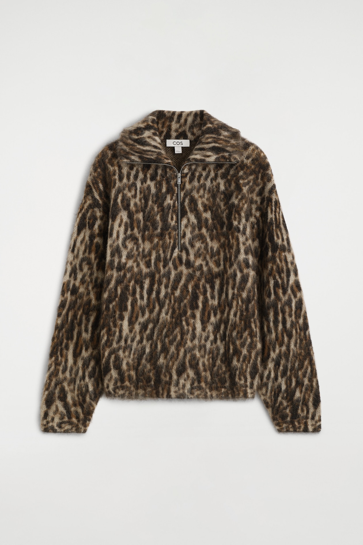 A mohair-blend knit jumper is shown from the front, featuring a brown and black leopard-print pattern with a brushed, fuzzy texture. The jumper has a half-zip funnel neck, long sleeves and a relaxed fit.