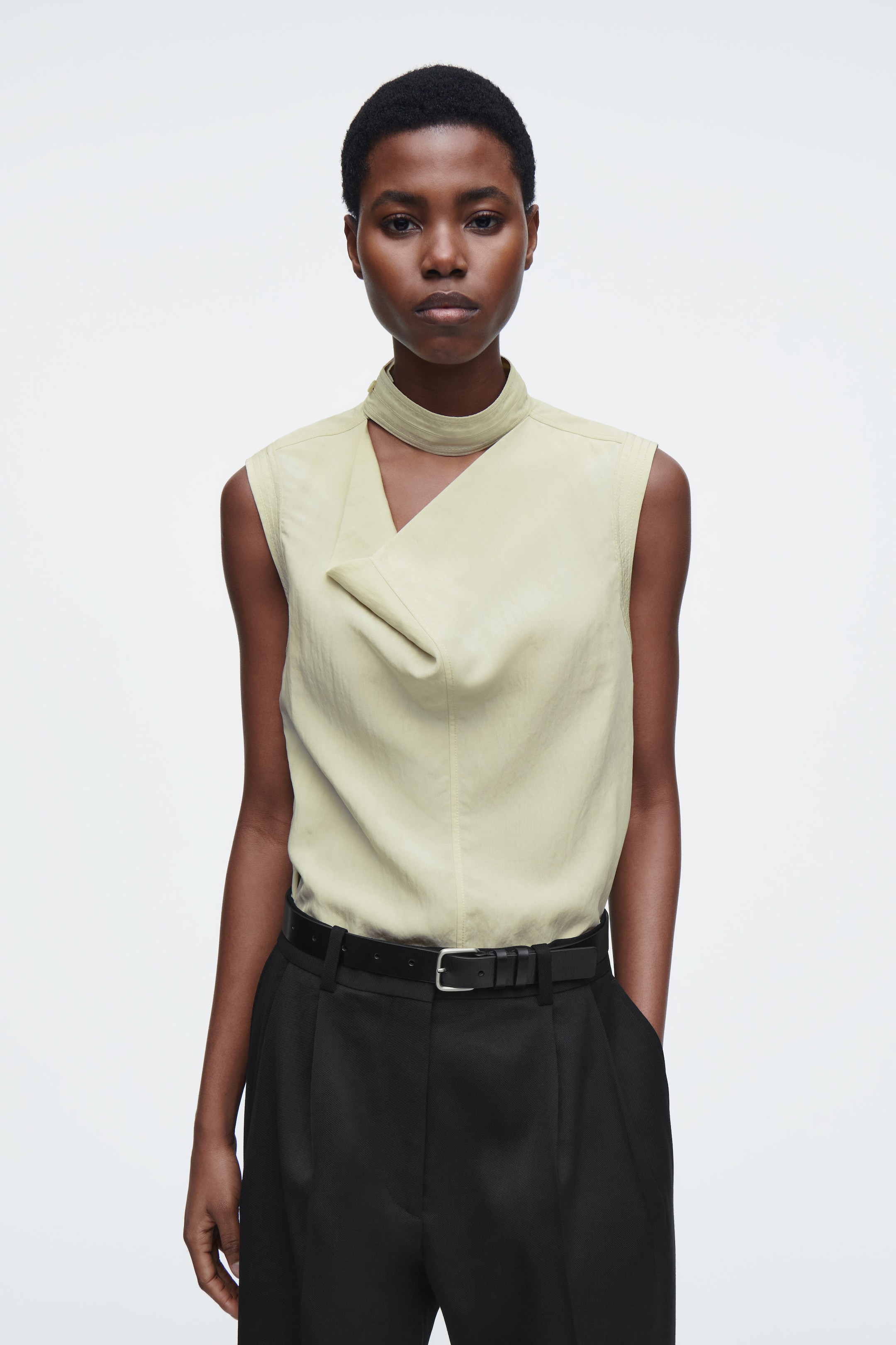 SLEEVELESS CUT-OUT COWL-NECK BLOUSE