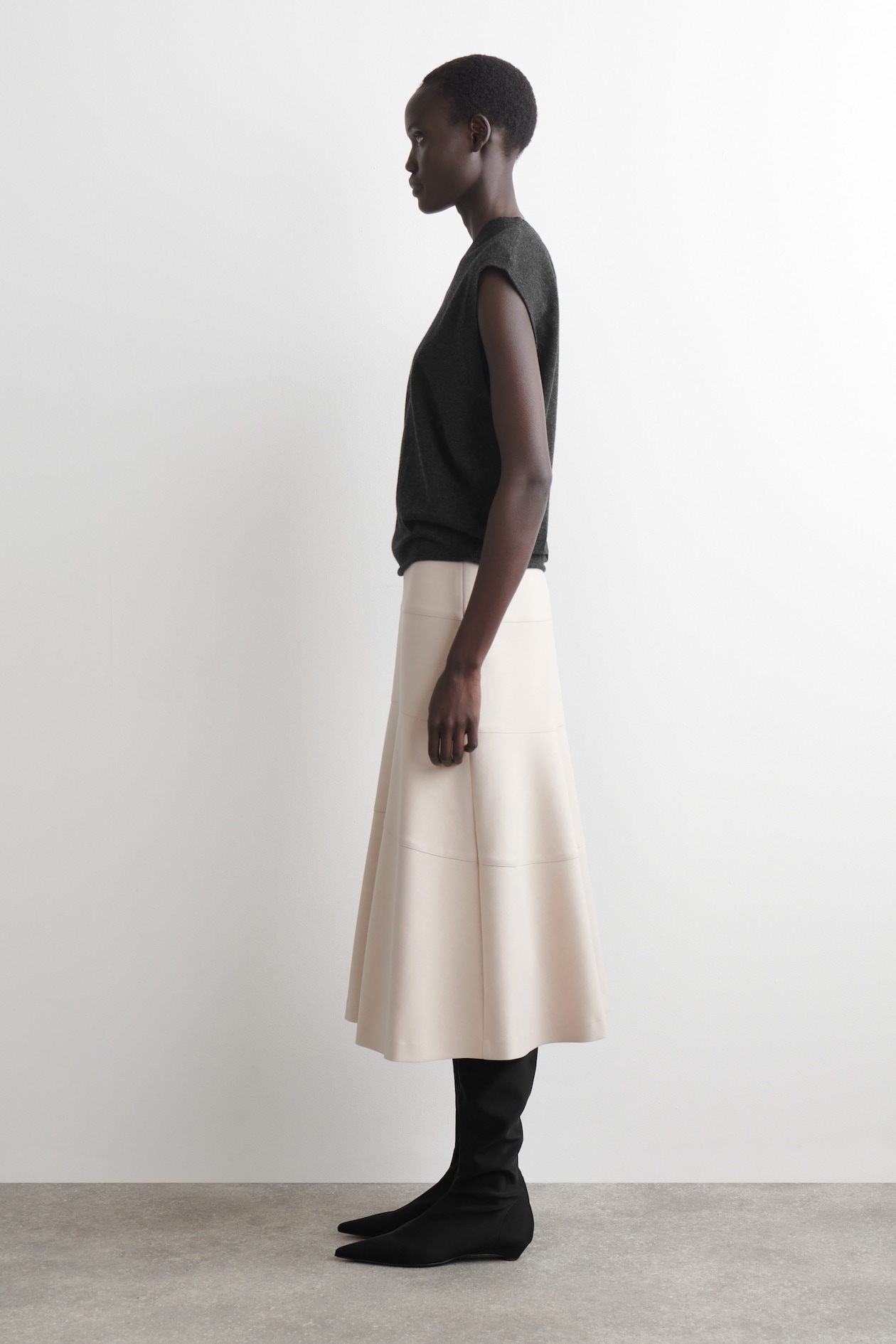 CURVED A-LINE MIDI SKIRT — LIGHT BEIGE