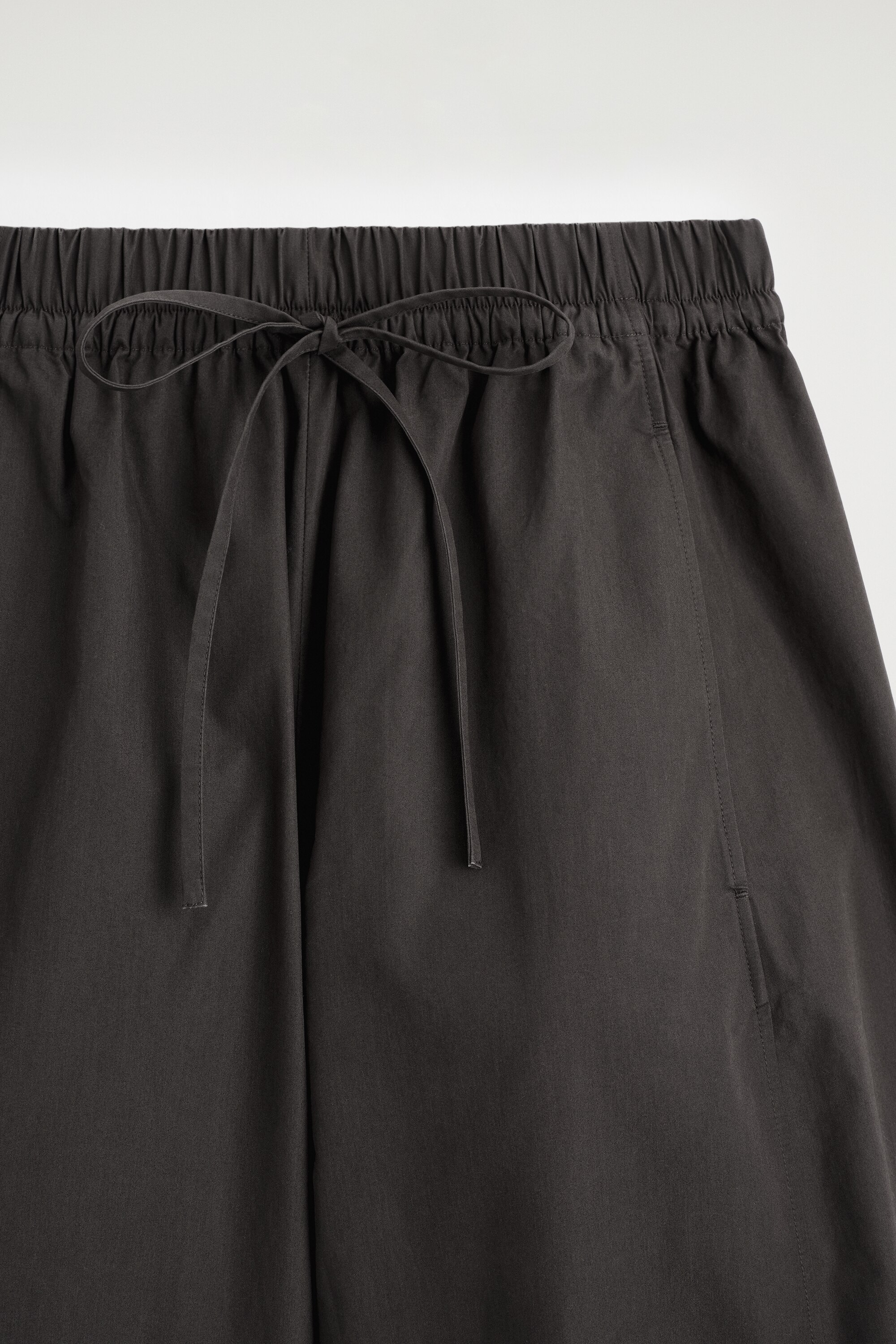 ELASTICATED BARREL-LEG TROUSERS