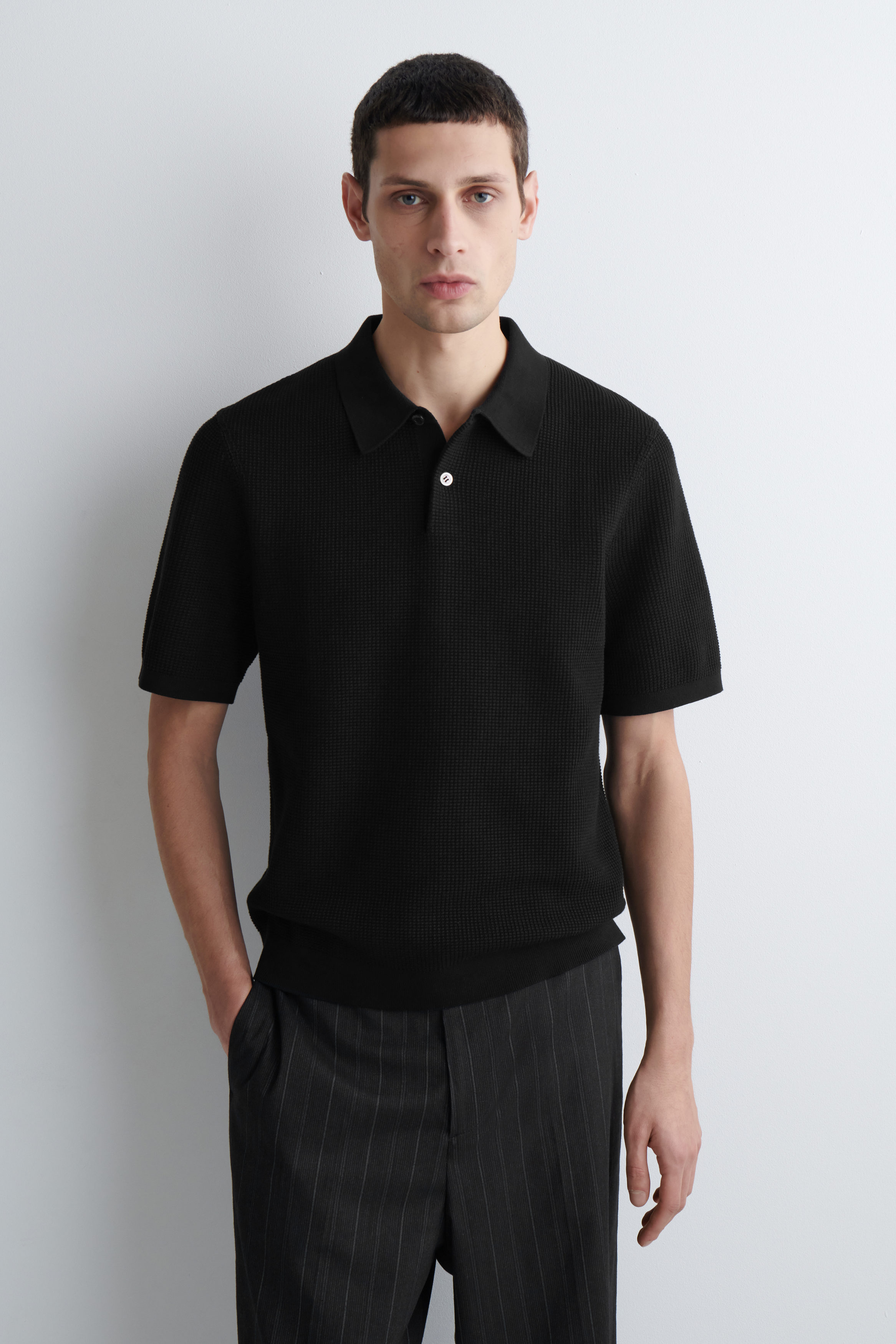 WAFFLE-KNIT COTTON POLO SHIRT - BLACK | COS US