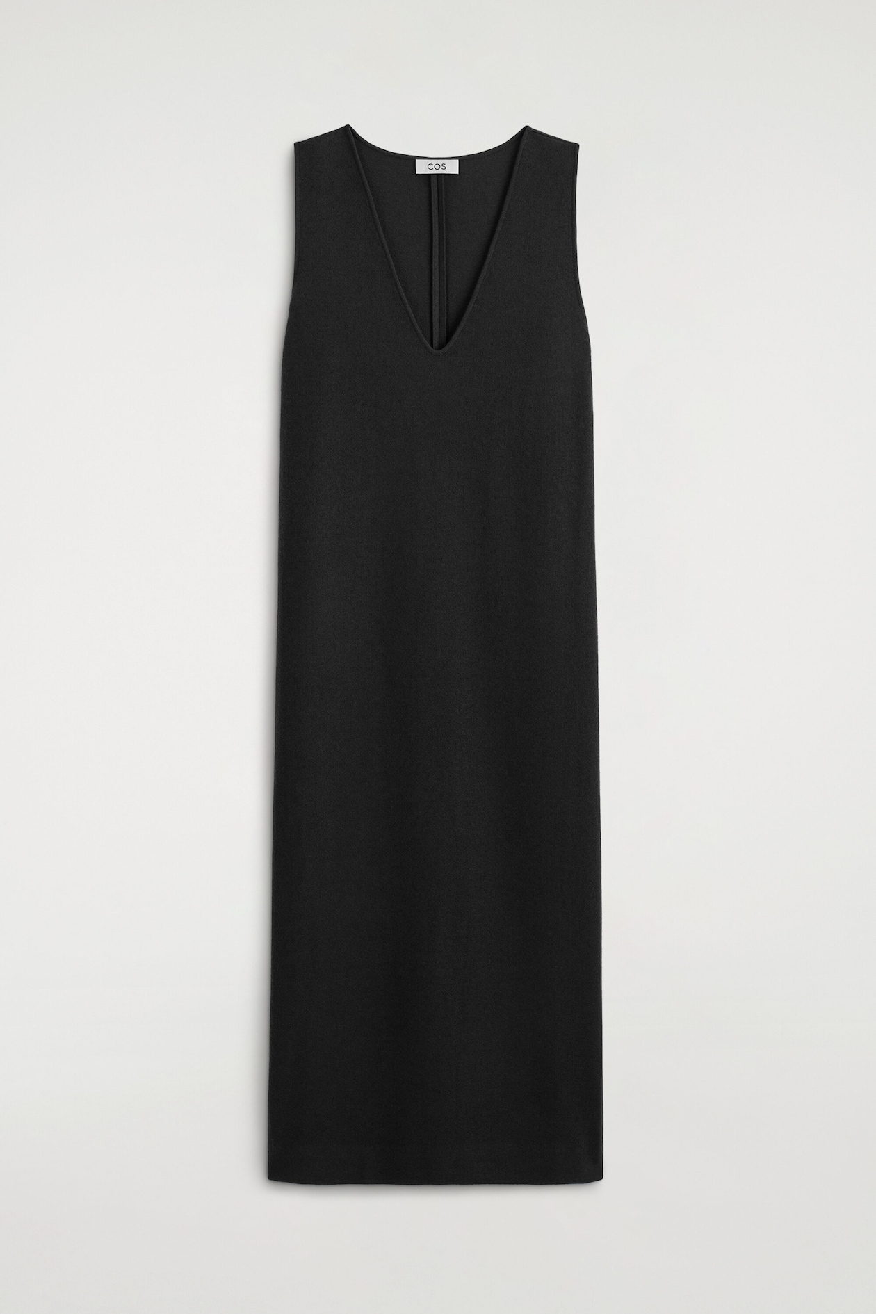 The black boiled wool-blend V-neck midi dress is shown from the front, featuring a deep V-neckline, sleeveless shoulders, and a straight, relaxed silhouette. The dress has a textured, matte finish with a clean, minimalist design.