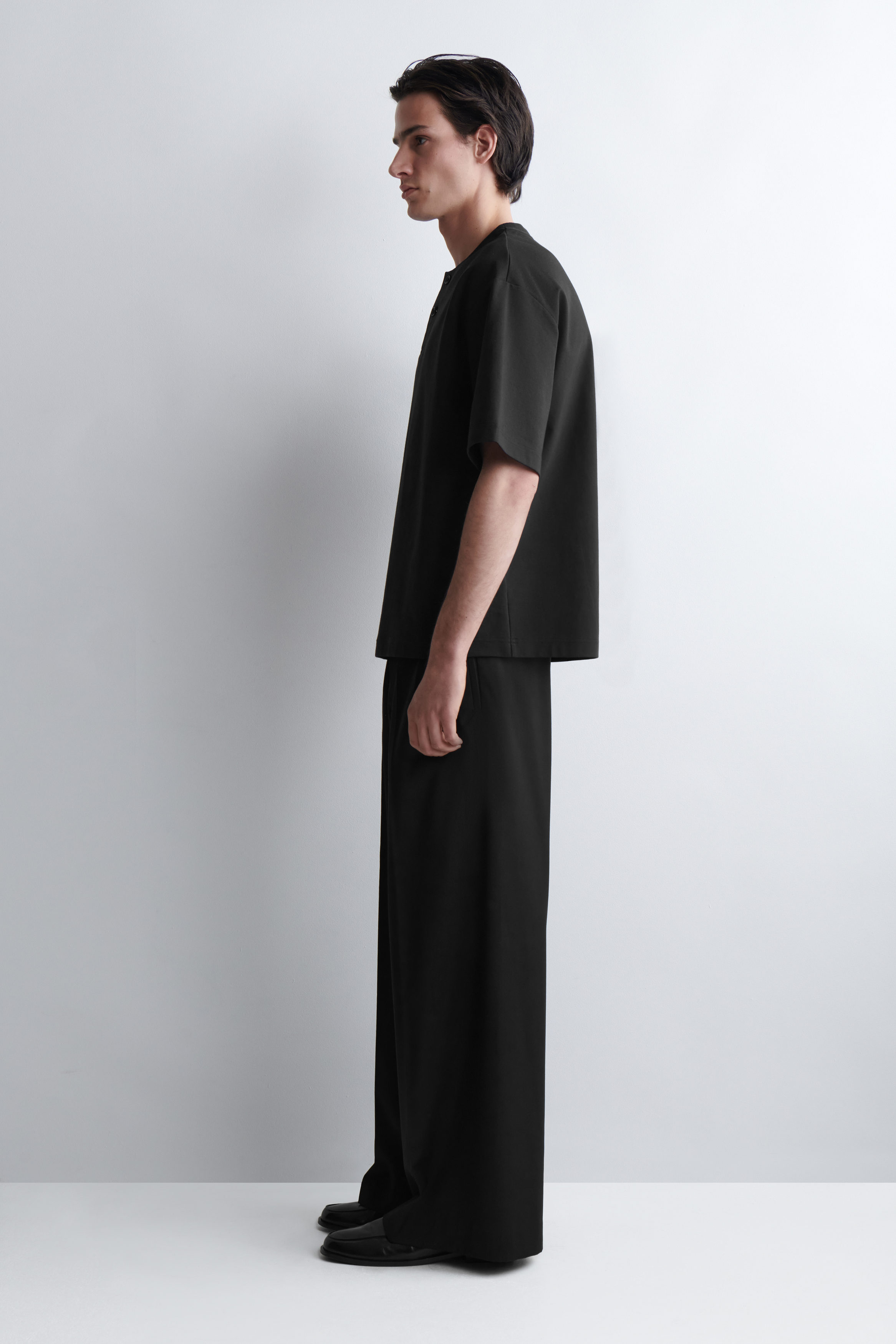 OVERSIZED COTTON-JERSEY HENLEY T-SHIRT - BLACK | COS US