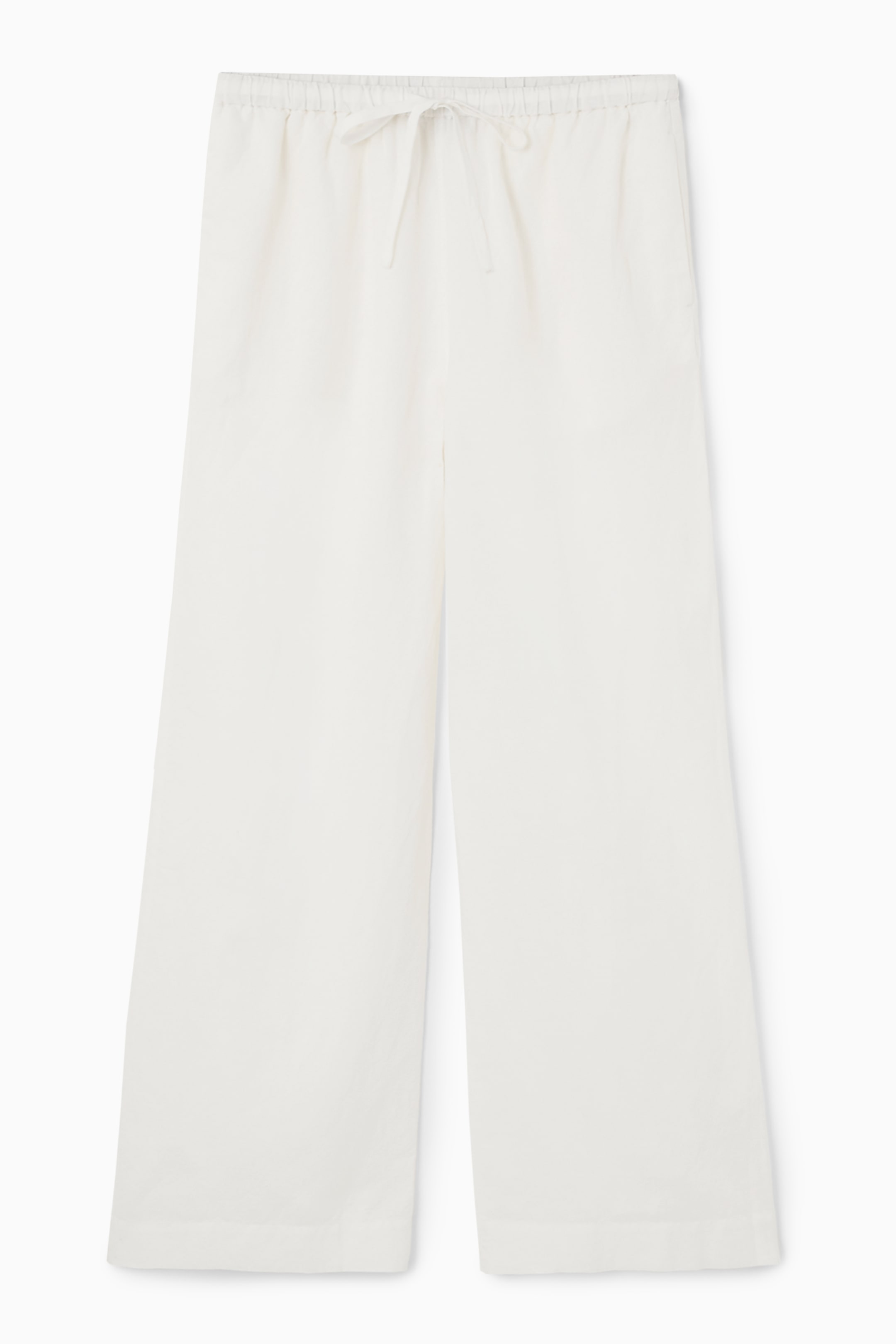 Visa större bild: LINNEBYXOR MED VIDA BEN OCH DRAGSKO - VIT - DAM | H&M SE 1