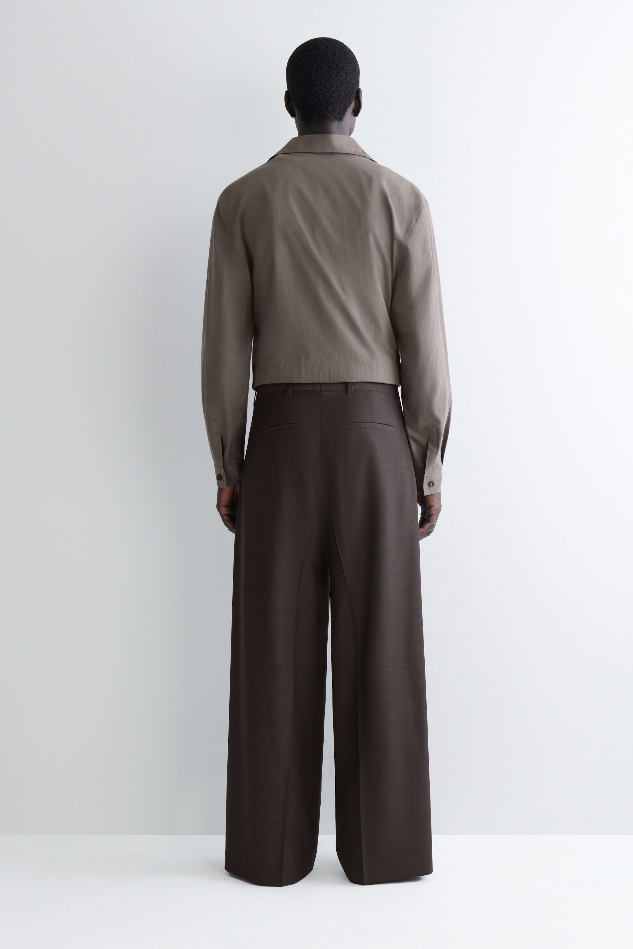 PLEATED WOOL WIDE-LEG TROUSERS