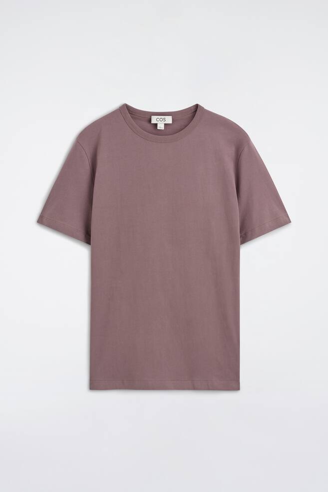 A dusty mauve T-shirt is shown from the front, featuring a classic crew neck and short sleeves. It presents a smooth fabric texture and a straight, relaxed fit. - 1