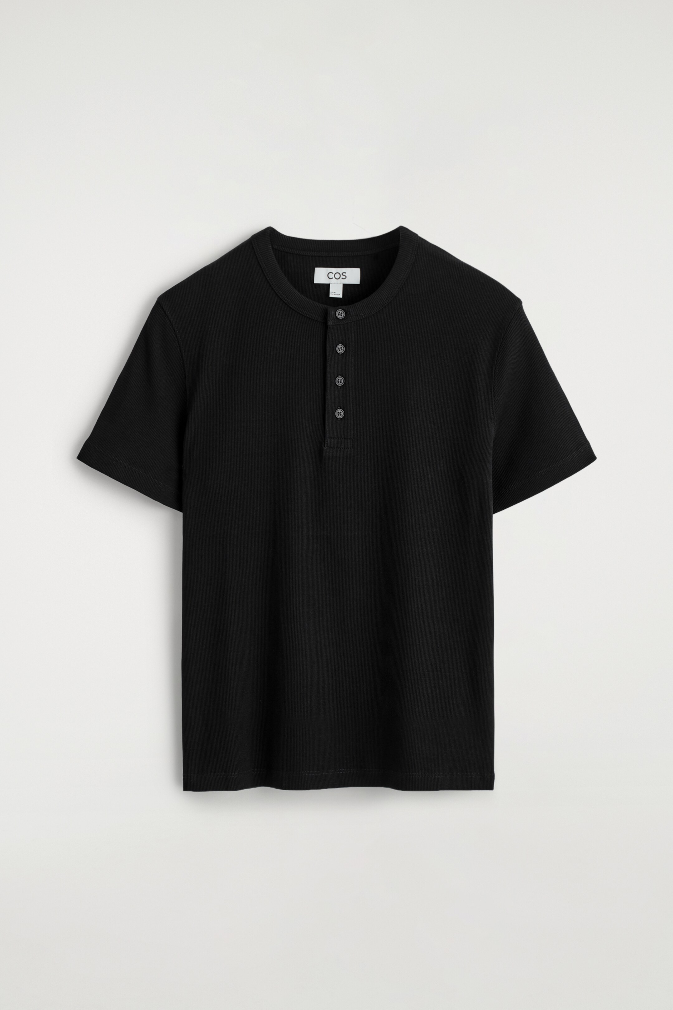 View larger image: A black Henley T-shirt is presenting as FRONT, featuring a finely ribbed texture. It is showcasing a slim fit with short sleeves and a four-button placket extending from the round neckline.