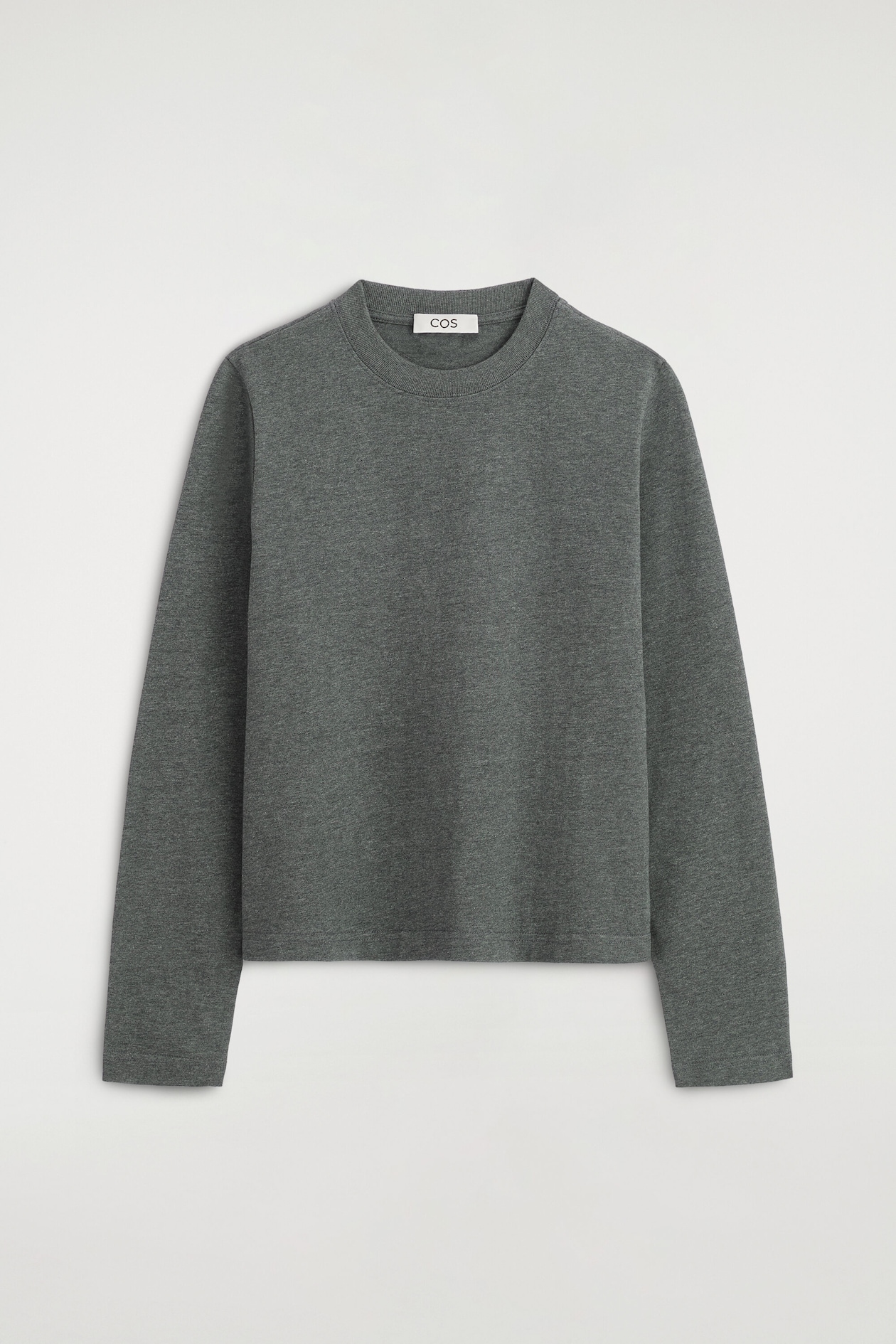 A clean-cut, long-sleeve T-shirt in charcoal gray melange is shown from the front, featuring a ribbed crew neckline, a straight hem, and clean-finished cuffs.