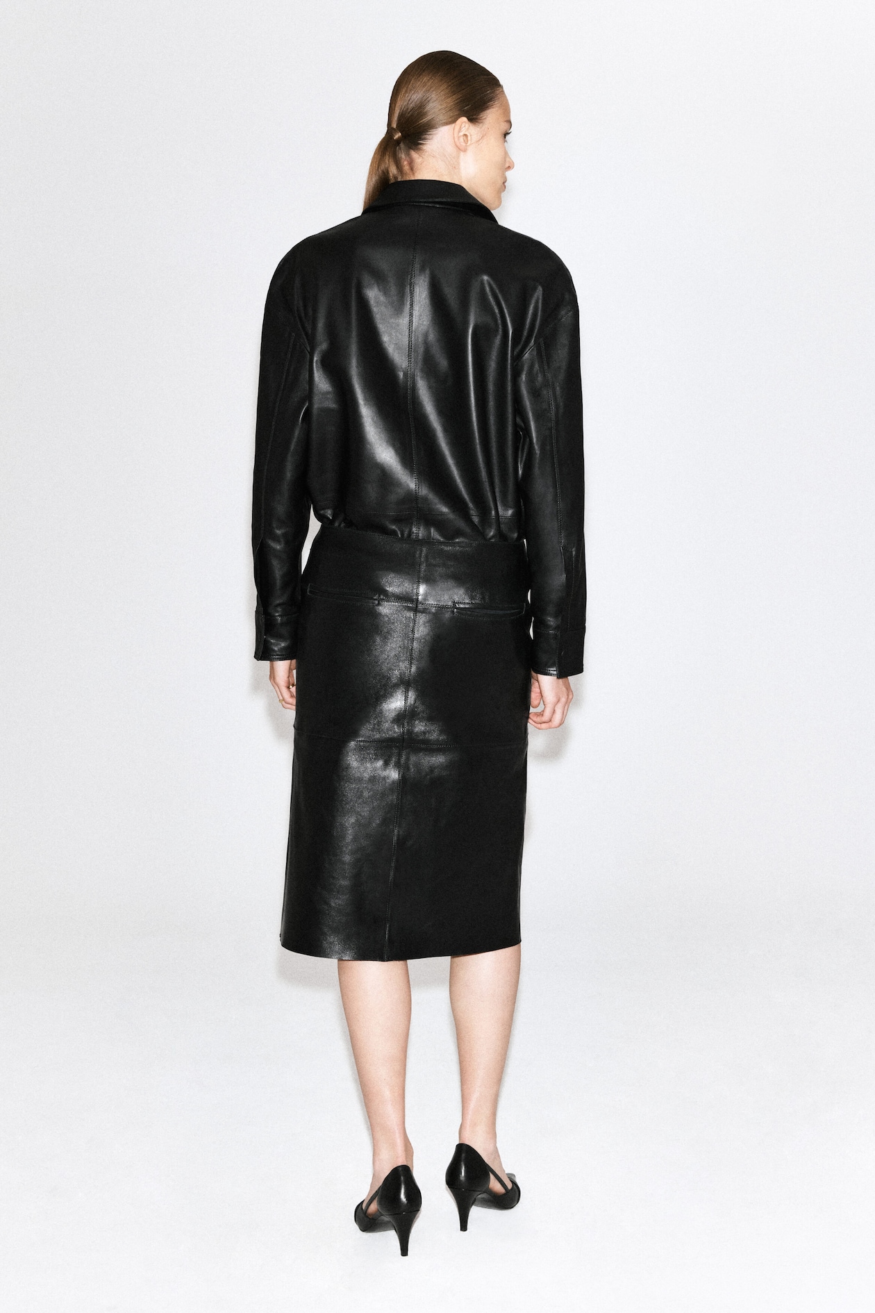 LEATHER MIDI SKIRT — BLACK