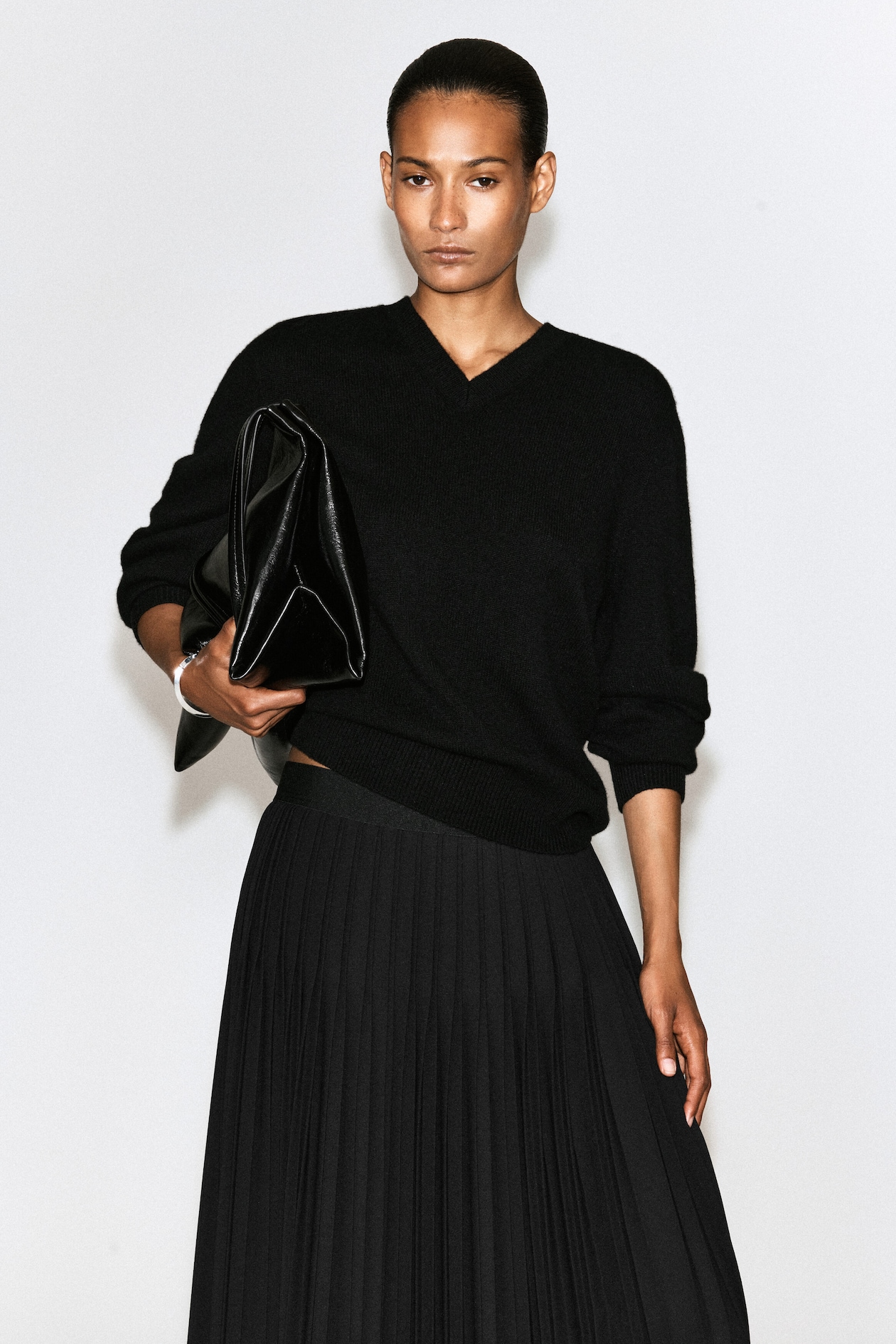 PLEATED CREPE MIDI SKIRT — BLACK