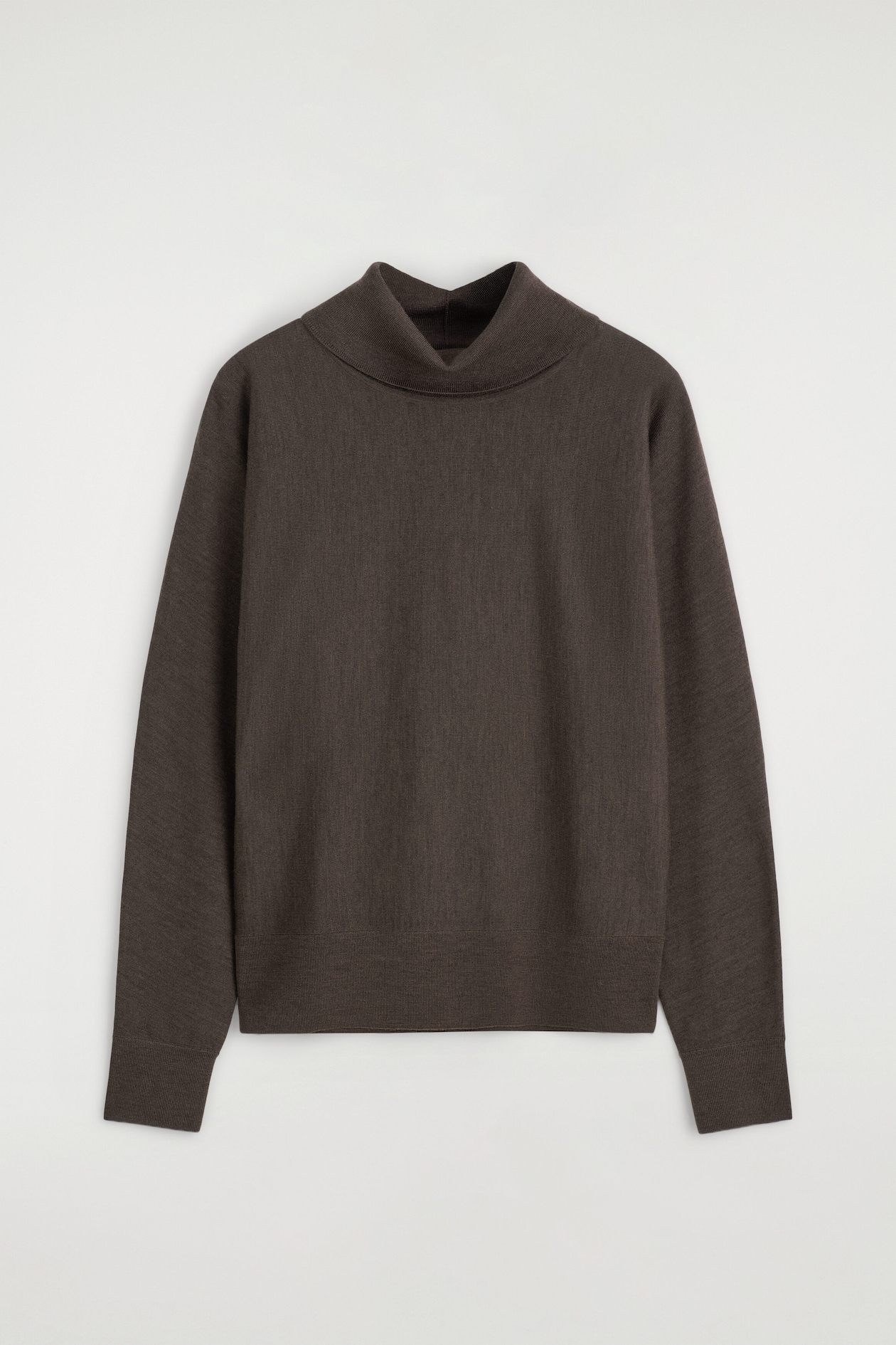 A dark brown knitted jumper is shown from the front, featuring a relaxed mock neck, long sleeves with ribbed cuffs, and a ribbed hem.