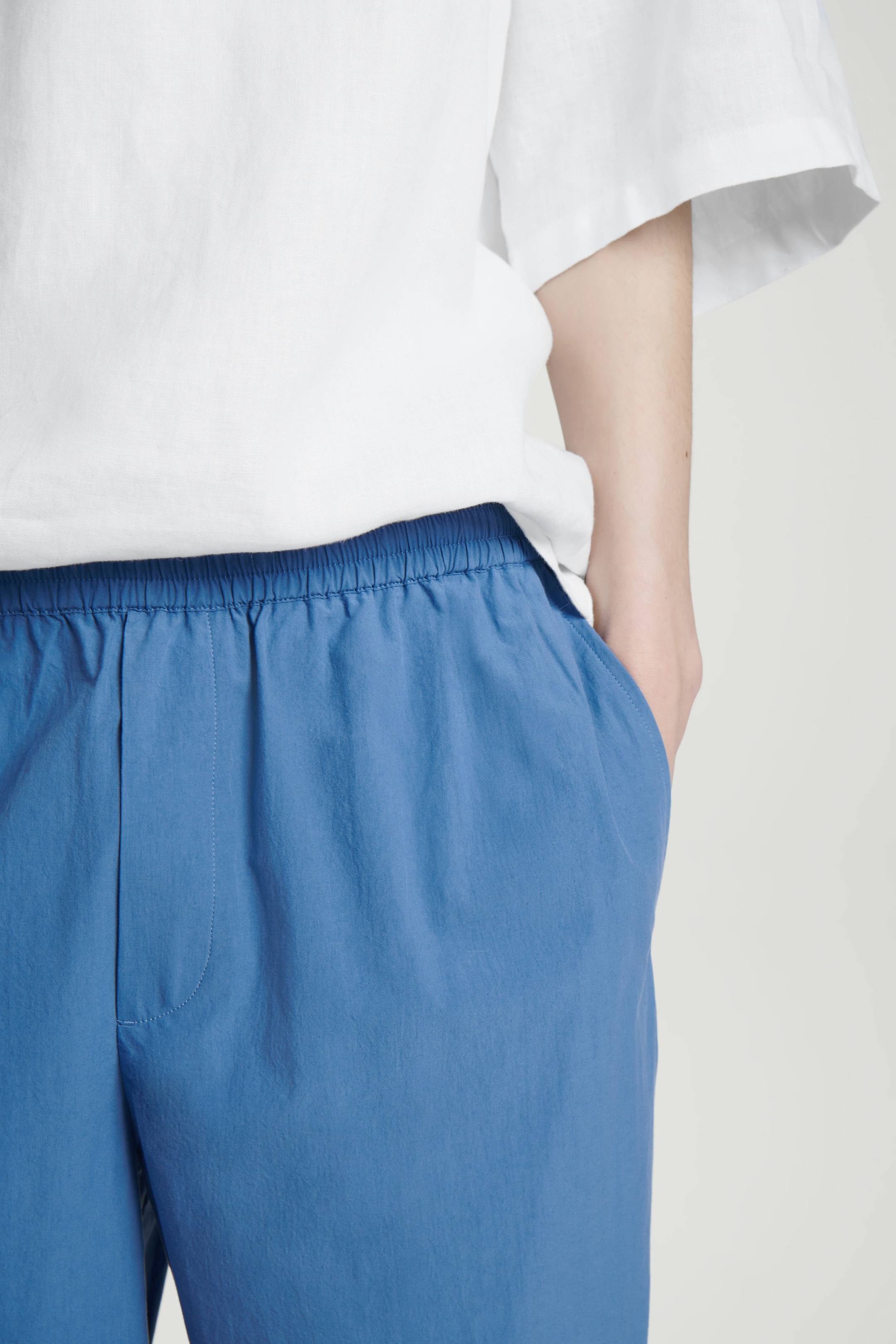 ELASTICATED COTTON TAPERED PANTS