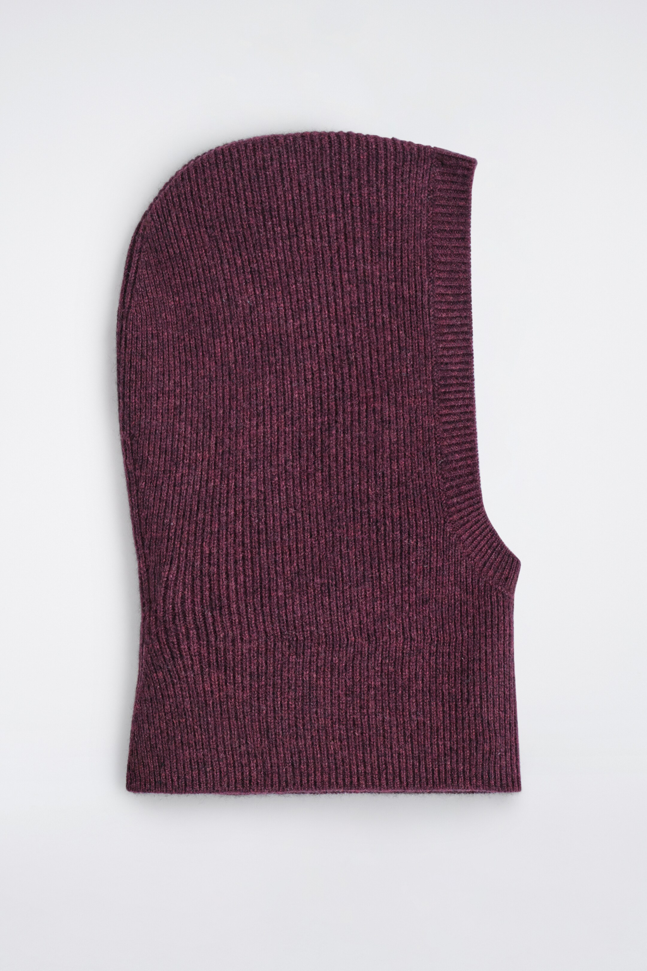 View larger image: A heathered burgundy rib-knitted balaclava is lying flat, facing FRONT. It is featuring a continuous ribbed pattern throughout its contoured shape, which includes an opening for the face.