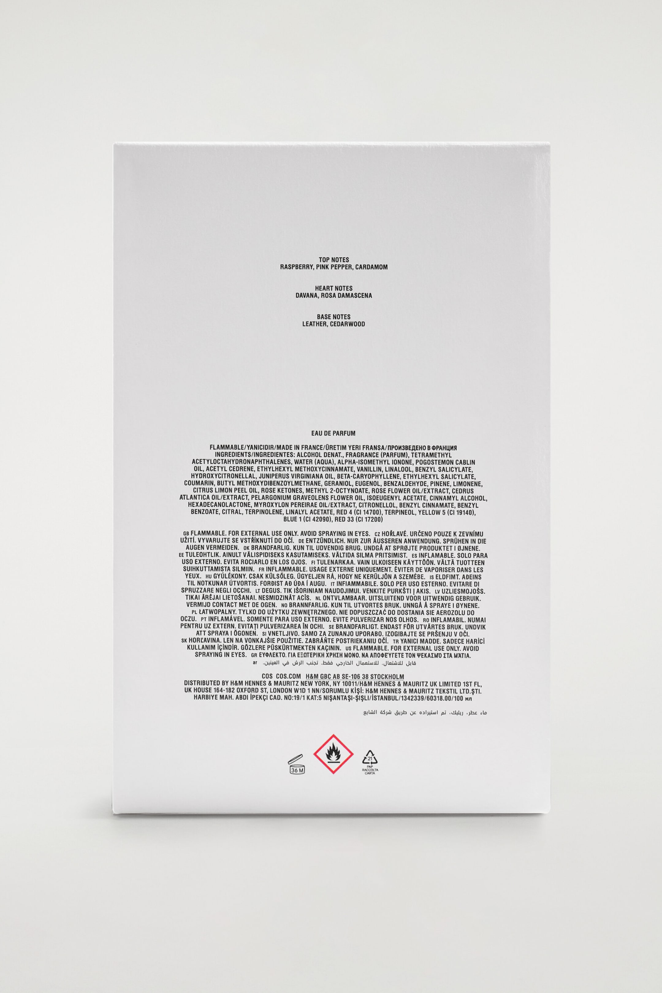 The back of the white rectangular packaging for COS Perfumery Eau de Parfum displays black printed text listing the fragrance’s top, heart and base notes. The lower portion shows a detailed list of ingredients, multilingual safety warnings and regulatory symbols near the bottom edge. The back of the white rectangular packaging for COS Perfumery Eau de Parfum displays black printed text listing the fragrance’s top, heart and base notes. The lower portion shows a detailed list of ingredients, multilingual safety warnings and regulatory symbols near the bottom edge.