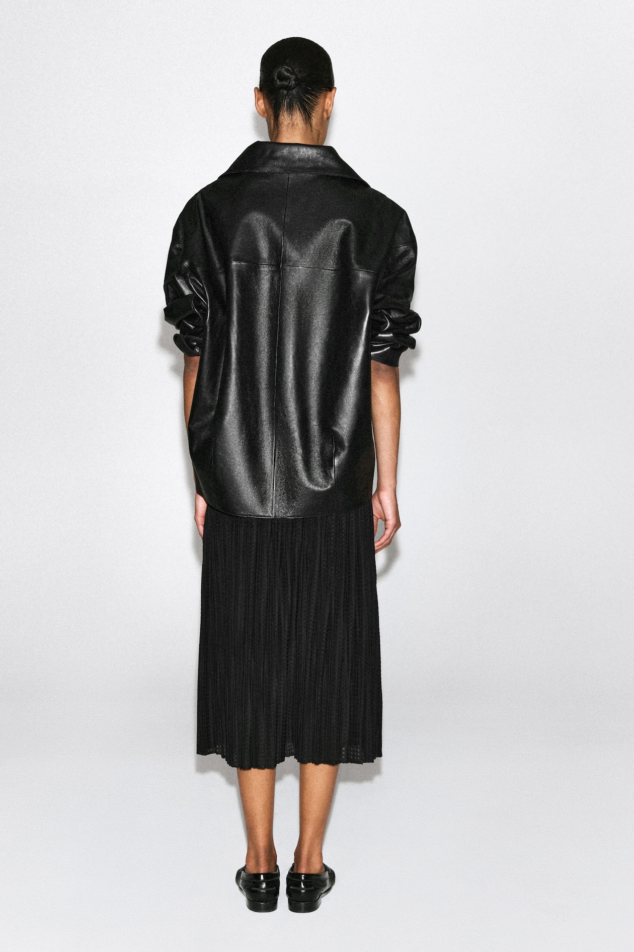 PLEATED JACQUARD MIDI SKIRT — BLACK