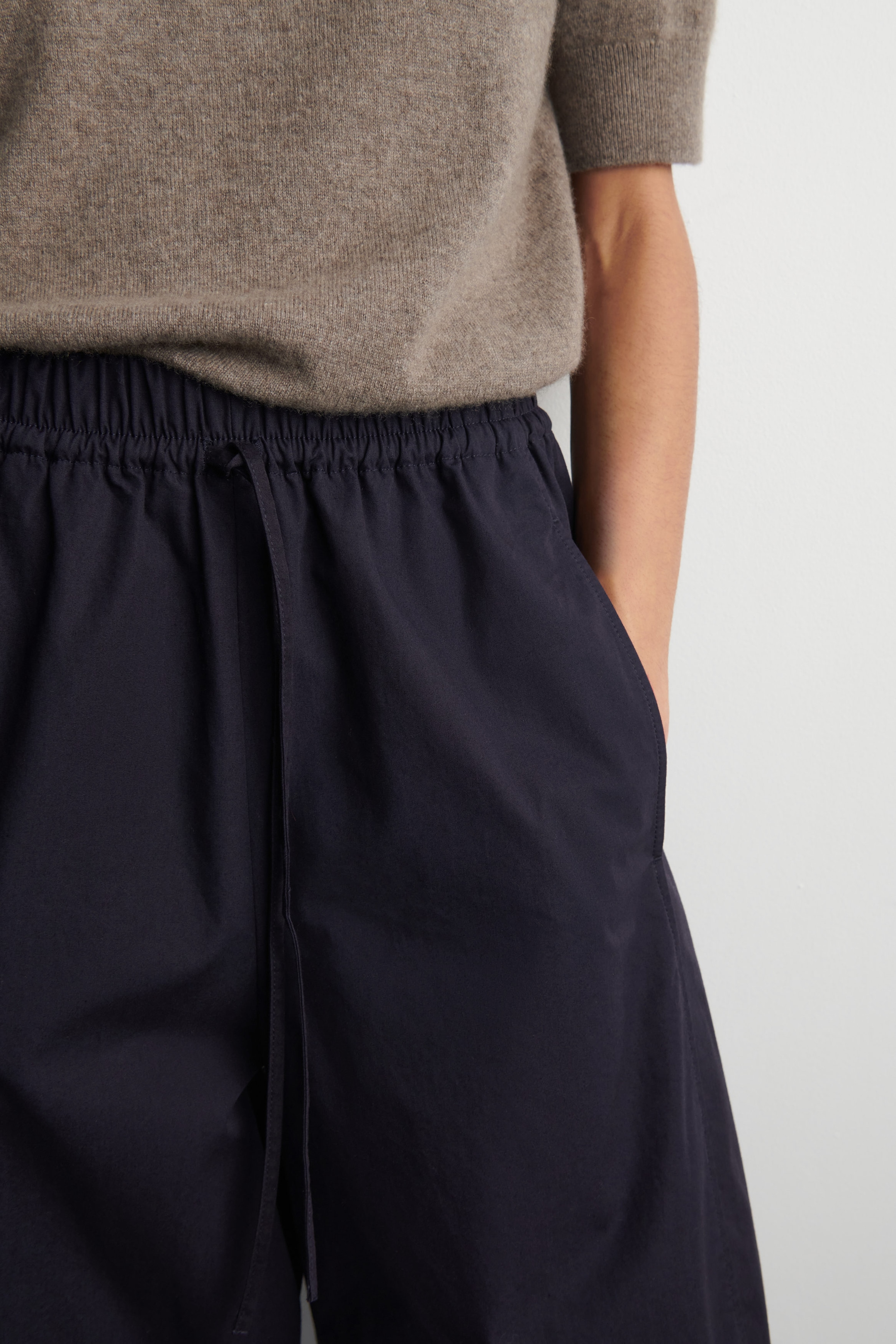 ELASTICATED BARREL-LEG TROUSERS