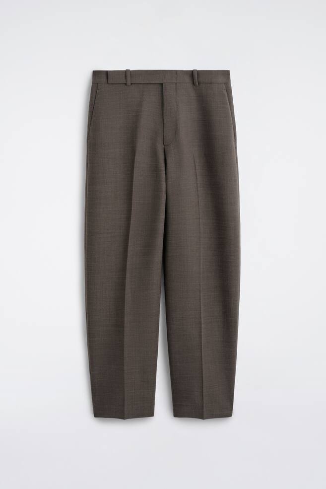 The wool-blend relaxed-fit straight-leg trousers are shown from the front, featuring a textured, dark taupe-grey fabric with a waistband including belt loops. The straight-cut legs display prominent pressed centre creases and subtle side slip pockets. - 1