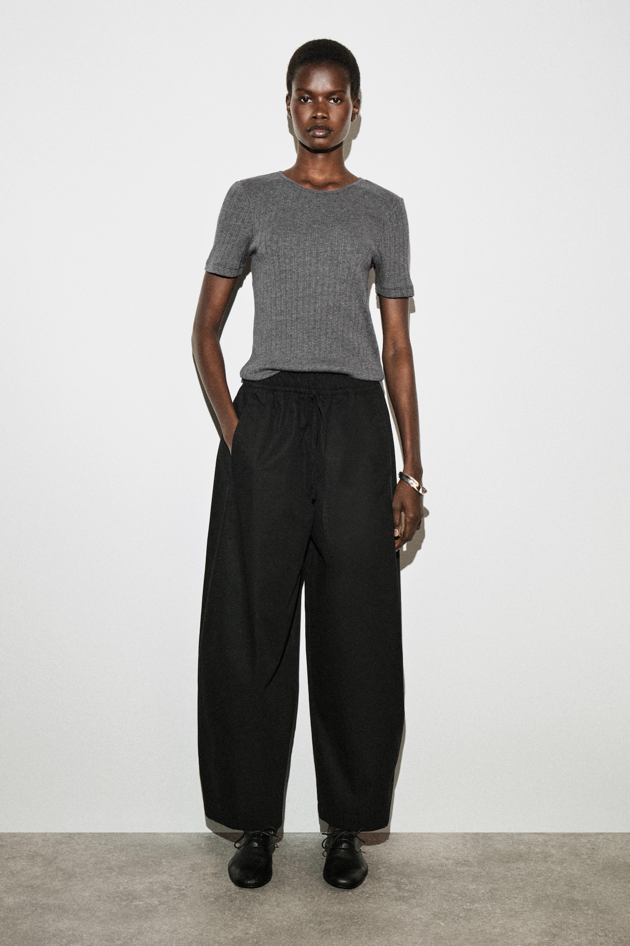 ELASTICATED BARREL-LEG TROUSERS