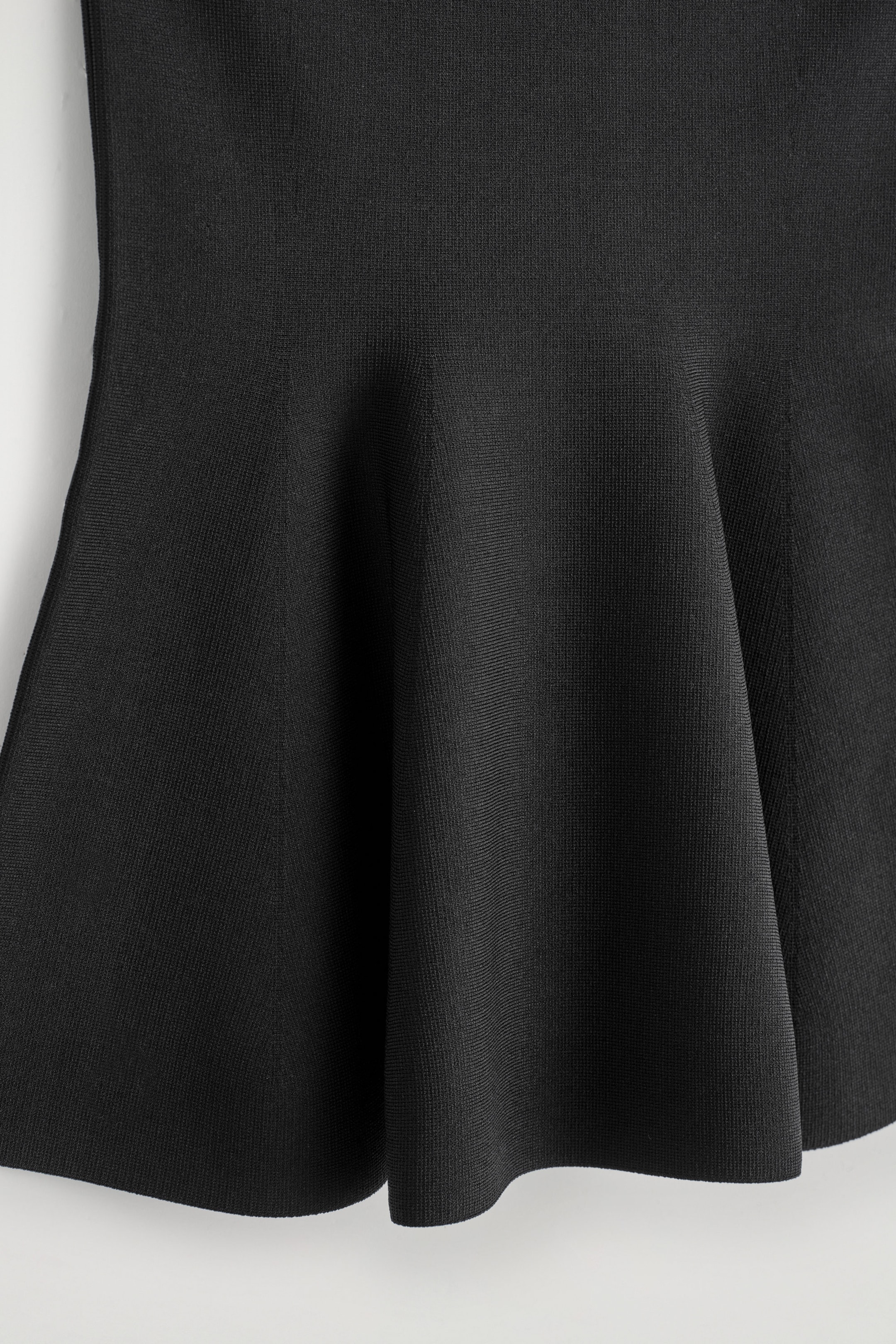 SHEER-DETAIL KNITTED PEPLUM TOP