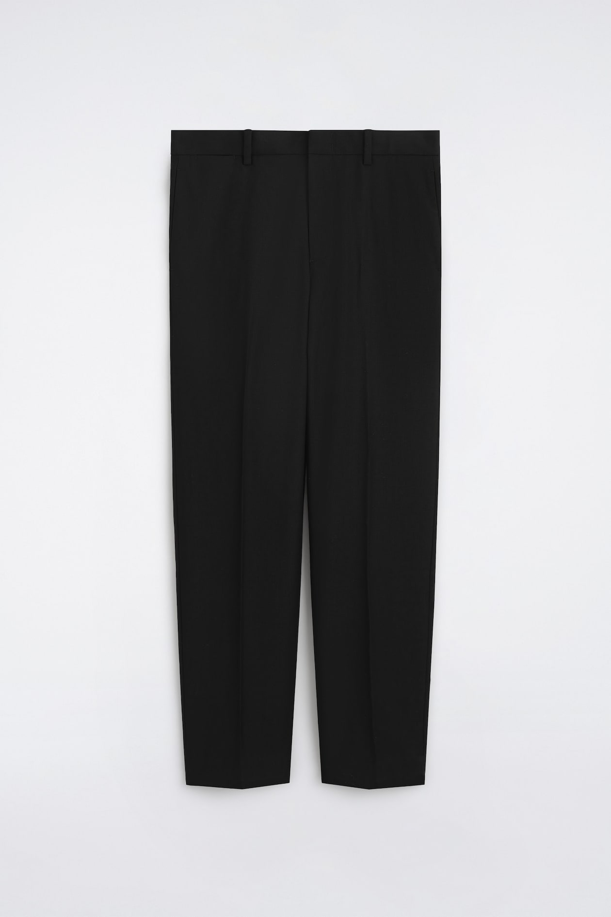 A pair of black, straight-leg trousers is shown from the front, featuring a structured waistband with belt loops, subtle side pockets, and sharp pressed creases running down each leg.