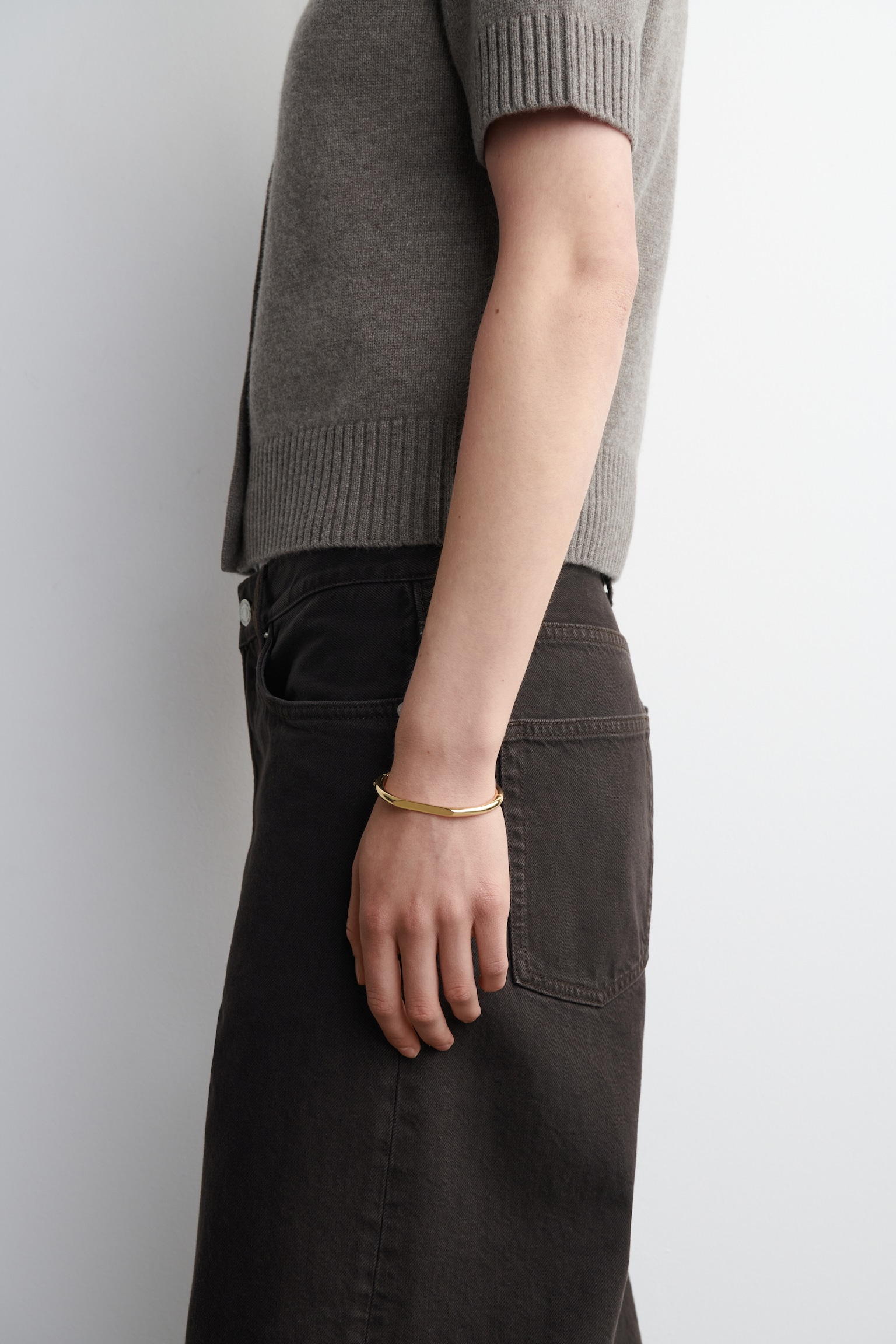 BRACCIALE RIGIDO DALLE LINEE SCOLPITE - ORO/ARGENTO