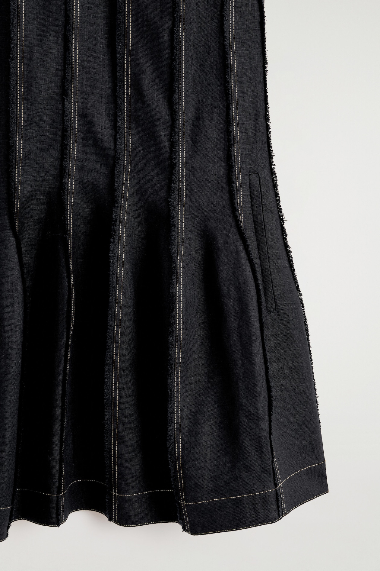 SCULPTED PLEATED MINI DRESS — BLACK