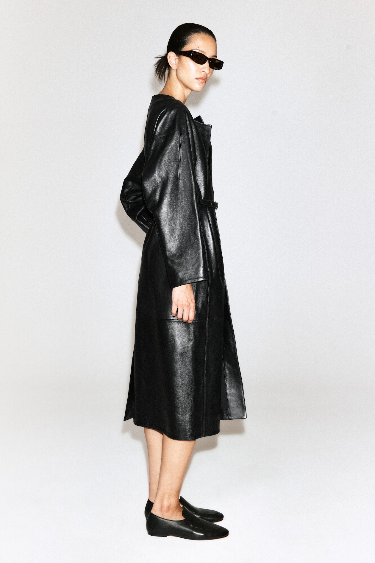 PANELED LEATHER LONG COAT — BLACK