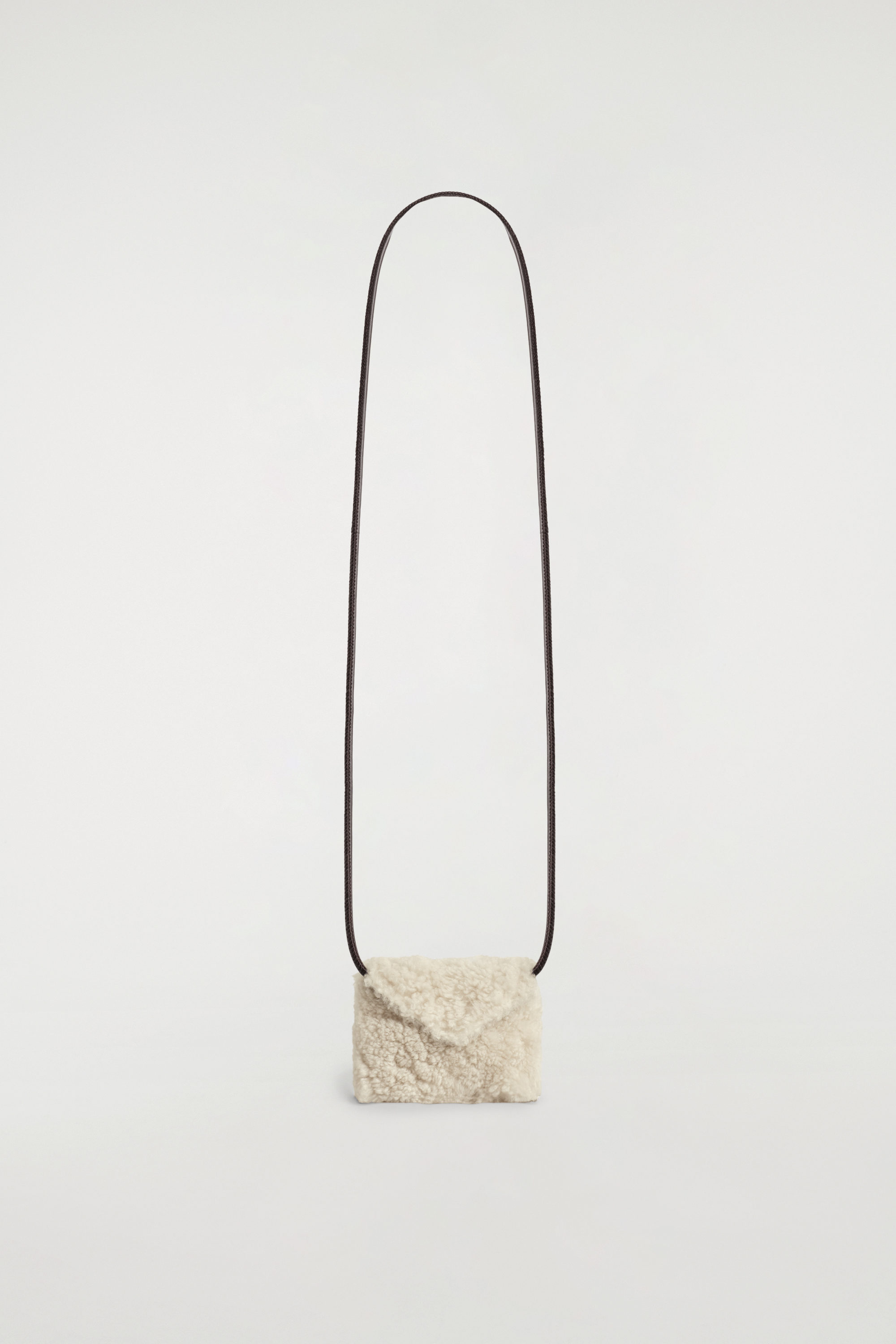 PILLOW QUILTED CLUTCH BAG - LEATHER - BLACK | COS