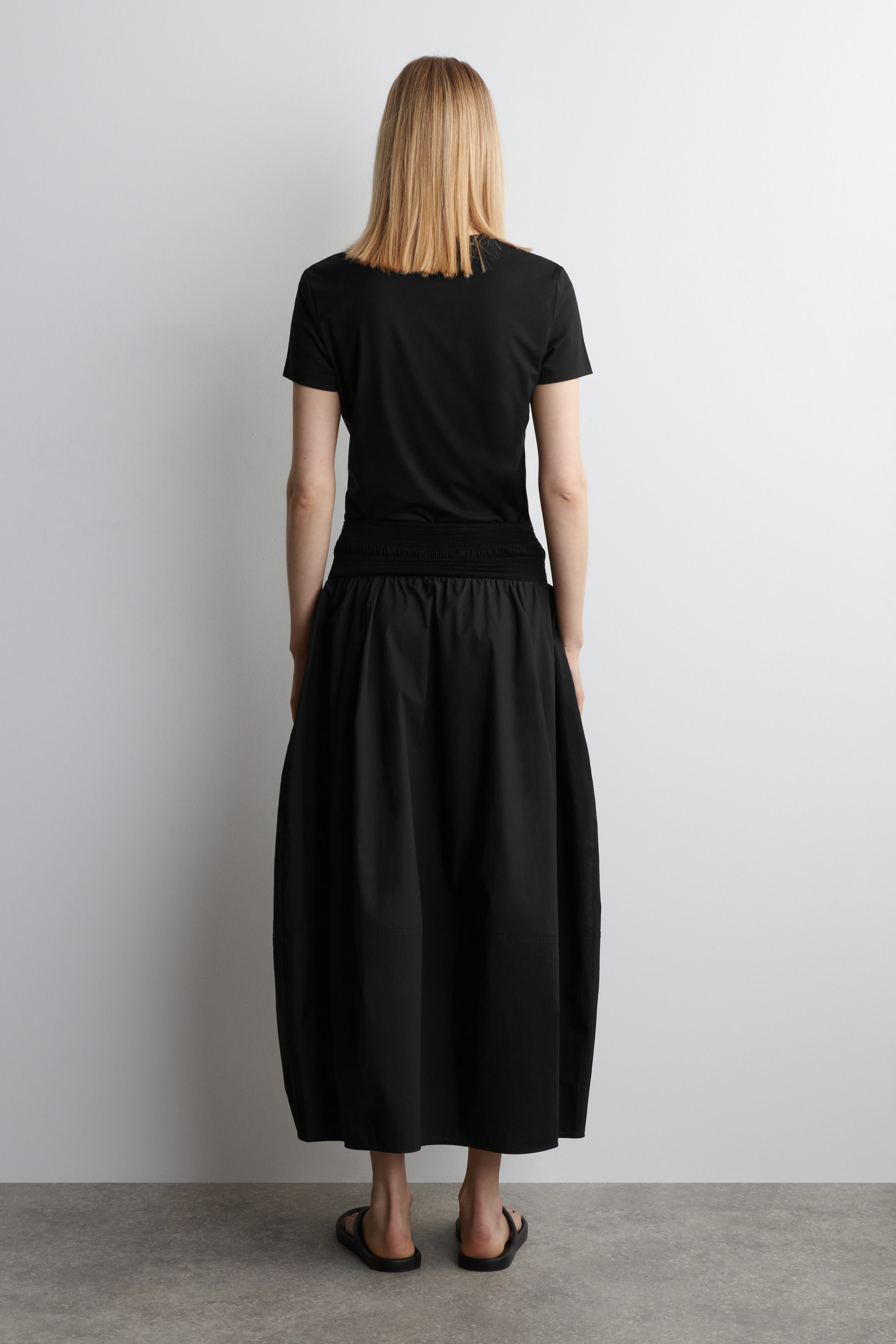 SMOCKED PANELED MIDI SKIRT