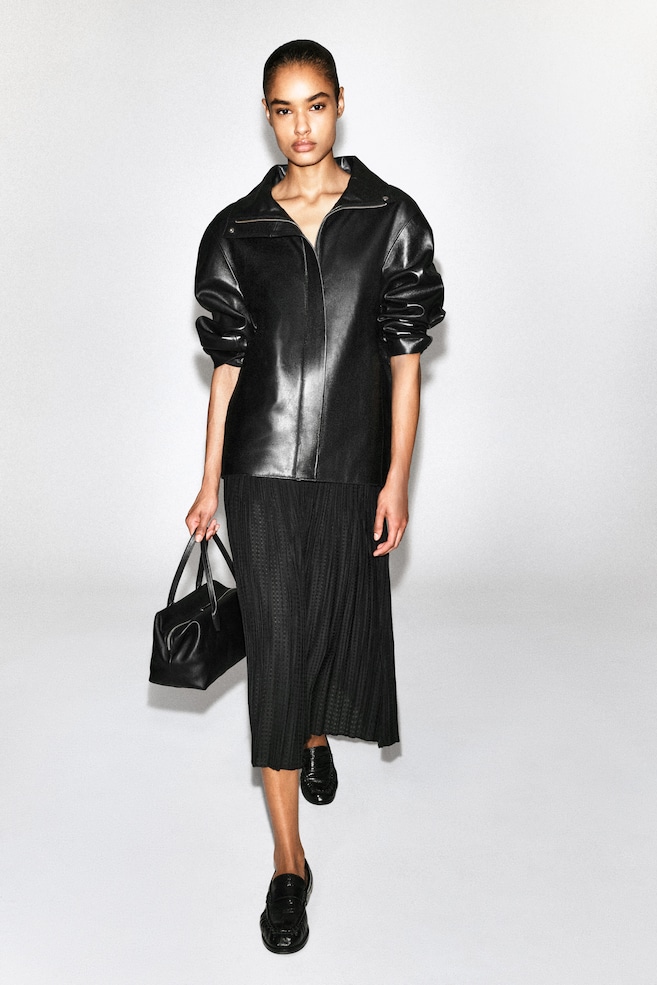 PLEATED JACQUARD MIDI SKIRT — BLACK